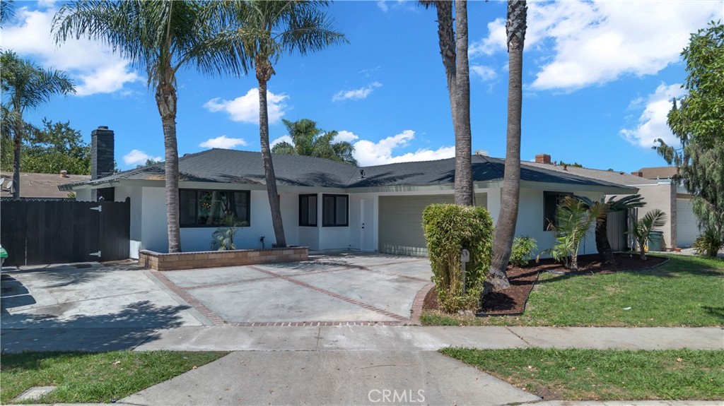Beautiful and remodeled home in a highly desirable Orange neighborhood! This is a 3 bedroom, 2 bath home with a 2 car garage and RV access. The interior floor plan boasts a large living room with multiple windows to let the natural light in and a cozy fireplace. The adjacent dining area is perfect for casual or formal dining. The kitchen, with updated cabinets and countertops, offers stainless appliances. Don’t miss the opportunity to make this home yours, where every detail has been thoughtfully selected to provide a lifestyle of modern luxury and comfort.