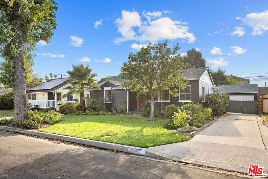 On a tree-lined street just steps from Sherman Oaks Fashion Square, this single-level home blends everyday convenience and comfort. With three bedrooms, two bathrooms, and over 1,500 square feet of living space, it's a welcoming lease in one of the Valley's most central neighborhoods. Large windows bring natural light into the living and dining area, where hardwood floors and crown molding add subtle character. A separate den with wood paneling and a fireplace provides a warm setting for quiet evenings. The kitchen is bright and functional, with easy access to the home's main living spaces. The primary suite features a private bathroom and opens to its own patio, creating a comfortable retreat. Two additional bedrooms offer flexibility for family, guests, or a home office. Outdoors, a covered patio and mature landscaping, including fruit trees, set the stage for relaxing or entertaining. The gated driveway and detached garage provide storage and convenience, while gardening service is included for easy upkeep. Situated just blocks from Fashion Square and minutes from Ventura Boulevard, the home is close to shopping, dining, coffee shops, and parks, with quick access to major freeways.