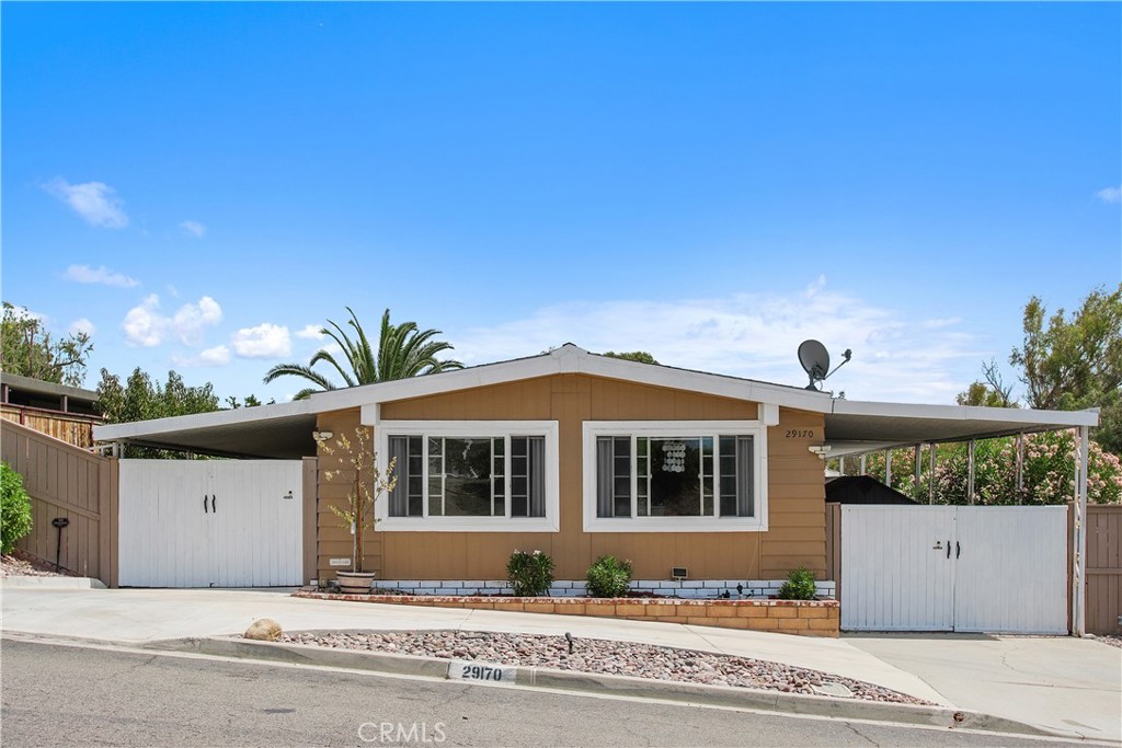 Charming 2 Bed, 2 Bath Home with Golf Course Views in 55+ Community. Step inside this beautifully upgraded home and take in sweeping fairway views of the golf course—right from your backyard. Featuring two spacious bedrooms and two bathrooms, this residence blends comfort and style with thoughtful enhancements throughout. Dual carports offer ample parking, complemented by generous outdoor storage and a versatile bonus space perfect for hobbies, projects, or a peaceful retreat. Life here feels like a permanent vacation. The vibrant 55+ community has something for everyone: unwind at the clubhouse, cool off in the swimming pools, stay active in the gym, or let your pup roam free at the dog park. All of this is just minutes from shopping, dining, and everyday conveniences.