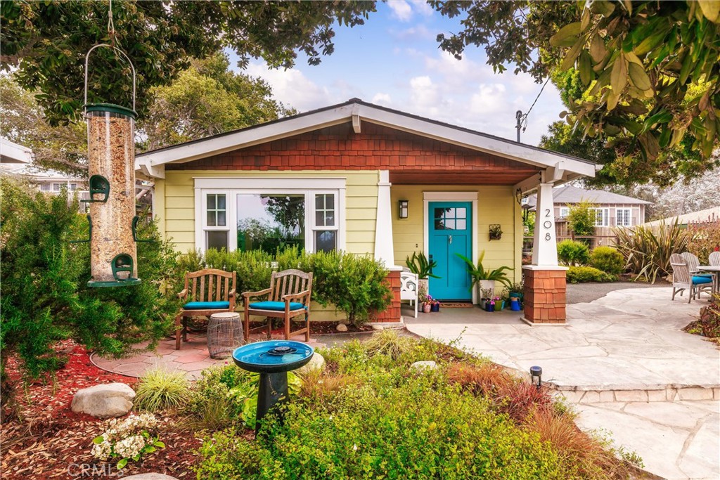 Welcome to your dream craftsman style cottage at 208 Shasta Ave in Morro Bay, perfectly nestled within one of its most coveted neighborhoods, the "Banana Belt" or Morro Bay Heights. This thoughtfully designed and comfortable home, feeling much larger than its 720 square feet, is ideally perched on a beautifully landscaped, street-to-street lot, offering ample, triple-sectioned yard space for entertaining, pets, and a dedicated garden area, setting the stage for delightful outdoor living and dining under the stars, truly embracing the best of the Central Coast lifestyle. Inside, enjoy the warmth of cork flooring and the open floor plan, cozying up by the living room fireplace or savoring ocean views from the dining room, while the large kitchen, boasting a charming farm sink and soapstone counters, promises a timeless classic feel perfect for any chef and entertaining. The custom-designed large bathroom features radiant heat floors and an updated shower and vanity, with convenient space for a washer and dryer. More opportunities await with the detached one-car garage that offers versatile possibilities as a workshop, art studio, office, or even a future ADU (subject to city verification). Whether seeking a retirement bungalow, a second home, or a first-time buyer's haven, this charming beach cottage, located just minutes from the water, Embarcadero, and downtown, perfectly defines classic coastal charm and appeals to all lifestyles.