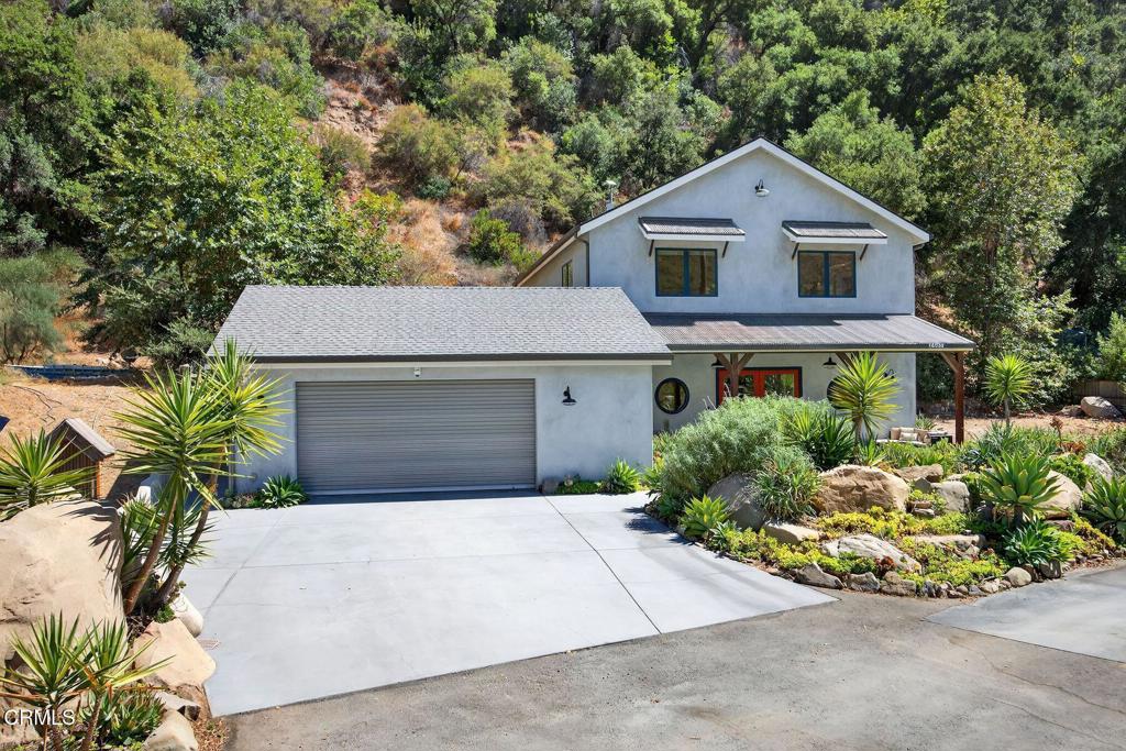 Built in 2019 with remarkable craftsmanship, this 4-bedroom, 3-bathroom home offers 2,901 square feet of living space on 1.59 acres, designed to combine modern luxury with timeless style. Smooth plaster walls, soaring ceilings, and abundant natural light create an atmosphere of refinement and warmth throughout. The chef's kitchen is the heart of the home, featuring a professional grade six burner stove, quartz countertops, a farm-style sink, generous center island, and abundant storage. Every detail is designed for both beauty and practicality. The primary suite offers comfort and character, complete with a custom dresser boasting 27 storage compartments, cozy window seats, built in bookshelves, skylights, two ceiling fans, and dual closets. Every element adds a touch of thoughtful design. Surrounded by nature, this property offers a true escape from the everyday. A nearby creek provides a refreshing retreat. Reconnect with nature while still enjoying the conveniences of home. Reliable high-speed internet ensures you can work or connect from anywhere, while energy-efficient features make remote living both sustainable and comfortable. Sustainability and self-sufficiency are at the forefront with solar panels w/ backup battery, a Tesla charging station, a generator, central air conditioning, and a private water well with advanced filtration systems delivering peace of mind alongside modern convenience. Large windows throughout frame serene views, while high ceilings and thoughtful indoor-outdoor flow encourage relaxation and connection to the natural surroundings. Despite its private, scenic location, the property is only minutes from downtown Ojai offering the rare combination of tranquility and accessibility. Whether you're preparing meals in the chef's kitchen, enjoying a book by the window seat, or cooling off in the creek, every aspect of this property speaks to a lifestyle of comfort, beauty, and connection.
