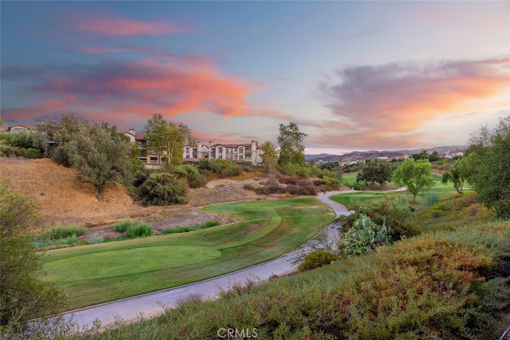 Discover the perfect blend of luxury, privacy, and location in this stunning three bedroom 2.5 bath townhome situated in the most desirable spot within the Cypress Point community in Westridge, Stevenson Ranch. This beautiful home offers a peaceful retreat, backing directly onto the golf course for breathtaking and serene views.
Step inside to an inviting open floor plan, where updated luxury vinyl plank flooring in a chic "Weathered Oak" finish flows seamlessly throughout. The home exudes a refined, luxe feel with elegant 4-inch plantation shutters, crown moulding, and 4-inch baseboards. The gourmet kitchen is a chef's dream, featuring a large island with unique glazed cement countertops, a modern glass tile backsplash, and newer stainless steel appliances, including a Samsung refrigerator. A ceiling fan in the dining area provides extra comfort. For convenience, a powder room (1/2 bath) is perfectly situated on the first floor. All plumbing fixtures have been updated to a stylish brushed nickel finish.
The spacious family room is perfect for relaxing, complete with a cozy fireplace featuring custom stacked stone. This home offers three generously sized bedrooms, each equipped with a ceiling fan and mirrored closet doors. The primary suite is a true sanctuary, boasting a large walk-in closet with a custom built-in organizer system, complete with shelving and drawers.
Additional modern conveniences include an attached 2-car garage with an EV charger (220 volts). Practicality meets style with a dedicated laundry room featuring tons of storage cabinets, an included smart LG Washer, a Whirlpool dryer, and ample under-the-stair storage. The home also includes a Nest thermostat.
Your private outdoor oasis awaits. The beautifully landscaped backyard features a large patio with a built-in cover, offering the perfect setting for entertaining or quiet relaxation while enjoying the gorgeous, sweeping views of the golf course.
Cypress Point living allows you to enjoy access to fantastic community amenities, including two sparkling pools, spa, tennis courts, playground, large private park and a stunning clubhouse. Don't miss this rare opportunity to live in a meticulously updated home in an unparalleled location. Access to award winning schools, dining, recreation, shopping and convenient access to transportation hubs.