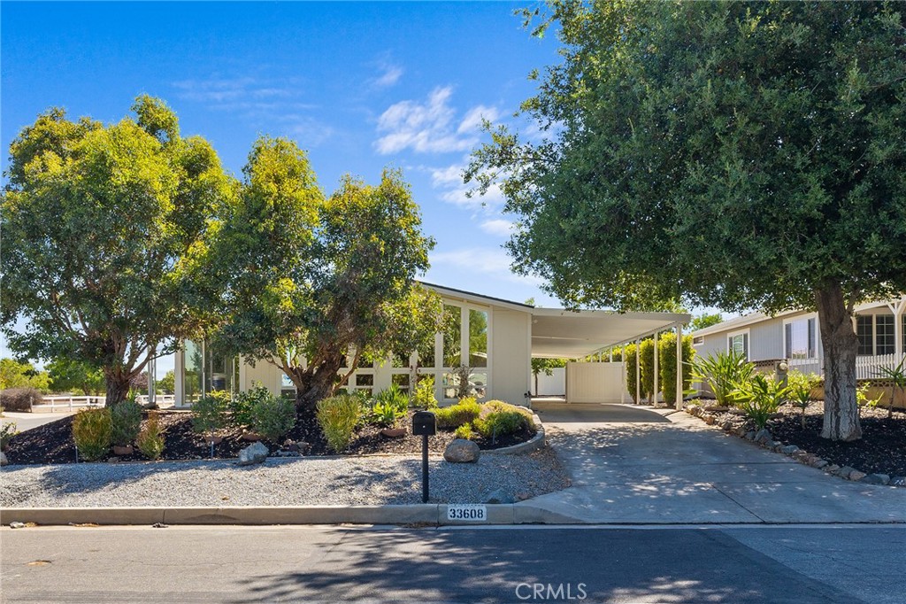 Welcome Home! This beautiful, well-appointed, corner lot single-story home has been fully renovated and is ready for you to move in! Walk into the stunning new kitchen where the spacious Quartz peninsula steals the show. The 12.7-foot by 9.2-foot and extra-wide peninsula offers optimal functionality. Floor-to-ceiling windows with vaulted ceilings in the living room allow natural light to fill the space, creating a grand ambiance. Luxury vinyl flooring throughout the house gives the space clean and seamless lines. The master bedroom features a stylish, custom-built-in entertainment center that can showcase a very large TV. The room also has custom wood wainscoting, adding an upgraded finish. The primary bathroom has been renovated to provide a spa-like experience with high-end finishes. Enjoy the bright sunroom off the great room for some quiet time and relaxation. During the 2021 renovation, the home received new plumbing lines and fixtures, as well as new recessed lights and subflooring. Every wall, including the ceilings, was upgraded with drywall and texture, and a new water heater was installed. Additionally, all air ducts, doors, casing, and baseboards were replaced. The exterior and interior have been recently painted with custom paint. In 2024, a new roof was installed, and in 2023, a new insulated garage door was installed. The backyard offers custom vinyl fencing and drought-resistant landscaping. The Farm is a beautiful master plan community. The low HOA offers three community swimming pools, two spas, a catch-and-release fishing pond, a dog park, and courts for basketball, soccer, and tennis. Additionally, the community features two tot lots and two RV storage areas. The Farm community offers a variety of planned activities and events throughout the year. Bring your offer, this immaculate beauty will not last!