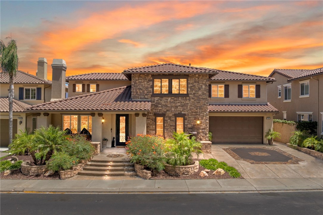 *PANORAMIC VIEWS* UPGRADES GALORE* MAIN FLOOR MULTI-GEN SUITE Welcome to luxury living in the GUARD GATED community of Greer Ranch. This Davidson-built Tuscan-style home w/ 4 BR, 4.5 BA + LOFT sits on a desirable SINGLE-LOADED STREET w/ STUNNING CURB APPEAL + NO REAR NEIGHBORS—custom stone façade, upgraded driveway, stone hardscape w/ steps & a high-end wrought iron entry door. Inside, a grand living & dining area features 9' ceilings, wood beams, elegant lighting & a cozy fireplace. The family rm, w/its own fireplace & dramatic stone accent walls, frames picturesque backyard views through oversized windows.The gourmet kitchen is a showpiece—huge island, granite counters, rich cabinetry, S.S. appliances, walk-in pantry & custom wine cellar w/ wrought iron door. One of the standout features is the MAIN FLOOR MULTI-GEN SUITE—complete w/ a private full bath & ATTACHED LIVING AREA, ideal for in-laws, guests, or a private home office. Also on the 1st floor: a spacious laundry room w/ abundant cabinetry, counter space, & sink + a 2nd guest bath. You'll have plenty of space for your cars & personal belongings in the 3-car GA w/built-in cabinets + newly replaced water heater. Upstairs, admire the wrought iron balusters, stairway accent lighting, detailed wall molding & stunning Restoration Hardware chandelier. The large LOFT anchors 2 SPACIOUS SECONDARY BEDROOMS (1 ensuite, 1 w/ adjacent bath), while the private primary suite offers a balcony where you can go unwind under the stars at the end of the day. The spa-inspired bath w/ custom tilework, soaking tub, oversized walk-in shower, dual vanities & CUSTOM closet is both beautiful & functional. And it's not very often that you'll find a home where you can shower while taking in the sweeping views, all in complete privacy. The backyard is an entertainer’s dream—step outside to a generous covered patio with a vaulted, pitched roof- ideal for entertaining or quiet evenings at home, a cozy gas firepit, low-maintenance turf & resort-style fountain—all overlooking BREATHTAKING PANORAMIC VIEWS! Greer Ranch offers 24-hr security, a pool & spa, nearby hiking & biking trails, parks, family-friendly events & more! W/ easy access to both the 215 & 15 fwy, lots of nearby shopping like Costco & Target, entertainment such as the renowned Temecula wineries, Pechanga casino & Old Towne Murrieta Market nights, & w/in the TOP-rated Murrieta schools, it makes this home a perfect blend of luxury, timeless style, + modern conveniences.