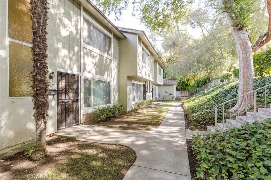 Welcome to 2061A E Aroma Drive, a charming two-bedroom, one-and-a-half-bath townhome in the highly desirable Galstar Wood community of West Covina. This residence has been recently updated with fresh paint and new flooring, creating a bright and inviting atmosphere. The home features an in-unit washer and dryer, and it is pet friendly. A large private patio opens directly to an expansive green space, perfect for kids to play or pets to enjoy. Nestled in a peaceful, quiet, and quaint part of the community, the property is ideally positioned near the pool and park, offering both relaxation and recreation just steps away. Conveniently located near shopping, dining, and freeway access, this home provides the perfect balance of comfort, charm, and accessibility.