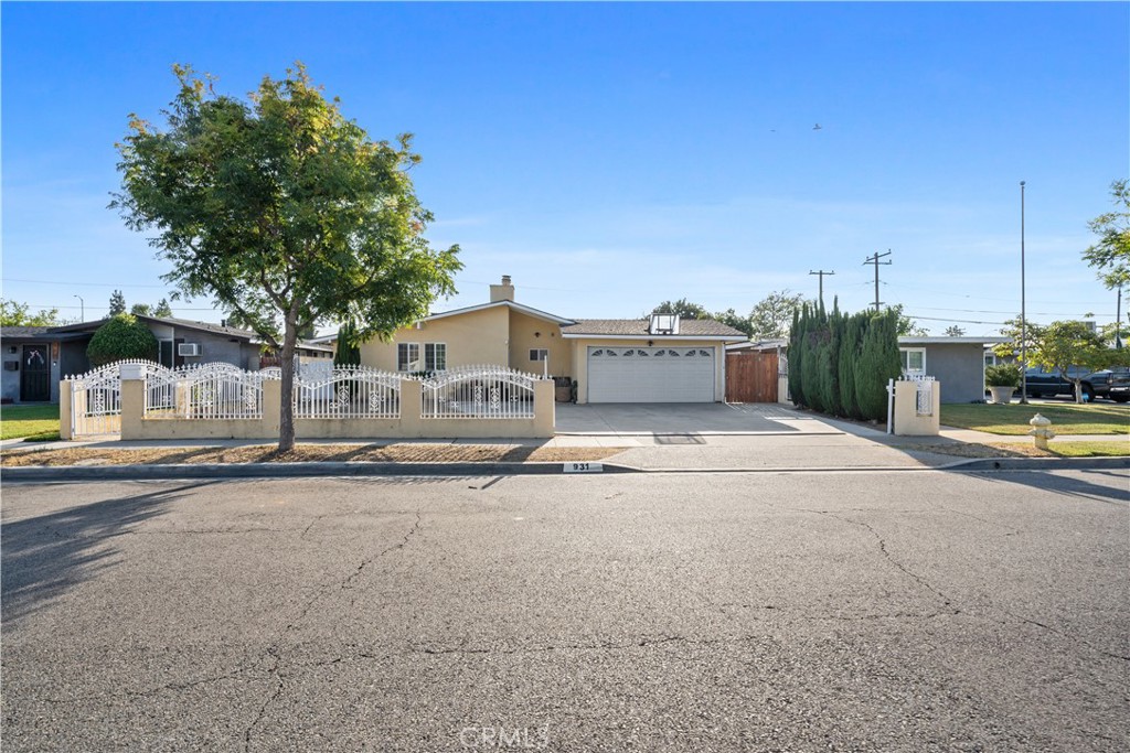 Welcome to 931 N Holly St, Anaheim — a rare opportunity to own a versatile single-story home with income potential in a prime location!
This spacious 4-bedroom, 3-bath home offers an ideal layout for multi-generational living or rental income. Sitting on a generous 6,420 sq. ft. lot, the property features an attached 2-car garage and an extended driveway with ample parking.
Inside, you'll find a beautifully remodeled kitchen, new flooring throughout, a cozy fireplace in the living room, and modern upgrades including a newer A/C unit, updated electrical panel, double-pane windows, and a Tesla charger. The primary suite includes a walk-in closet and updated finishes.
What sets this home apart is its unique layout. One side features 2 bedrooms, an office/den/bonus room, and 2 bathrooms — perfect for a growing family or work-from-home setup. The other side is a private 1 bed, 1 bath unit with its own entrance, currently rented for $1,500/month. The lease ends in August and will be delivered vacant at closing, providing full flexibility for future use.
Located just minutes from Disneyland, the Anaheim Packing District, Angel Stadium, and major freeways (5, 91, and 57), this property offers unbeatable convenience to schools, parks, dining, and shopping.