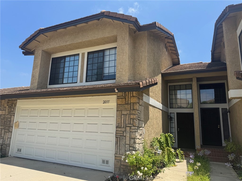 Welcome to this spacious 3-bedroom, 3-bathroom condo nestled in the desirable Glendora Springs Community. The inviting living room features a cozy fireplace, perfect for cool winter evenings. The kitchen is equipped with granite countertops, a built-in microwave, and a dishwasher, and seamlessly opens to the dining area—ideal for entertaining. Step outside to a shaded backyard patio, great for hosting guests or enjoying quiet outdoor moments. All three bedrooms are located upstairs, including a generous primary suite with a private full bathroom. An additional full bath serves the secondary bedrooms, while a convenient guest bathroom is located on the main floor. The home includes central air and heat for year-round comfort. Enjoy community amenities such as a sparkling pool, relaxing spa, and tennis court. Located within the highly rated Glendora Unified School District, this home offers both comfort and convenience in a well-maintained setting.