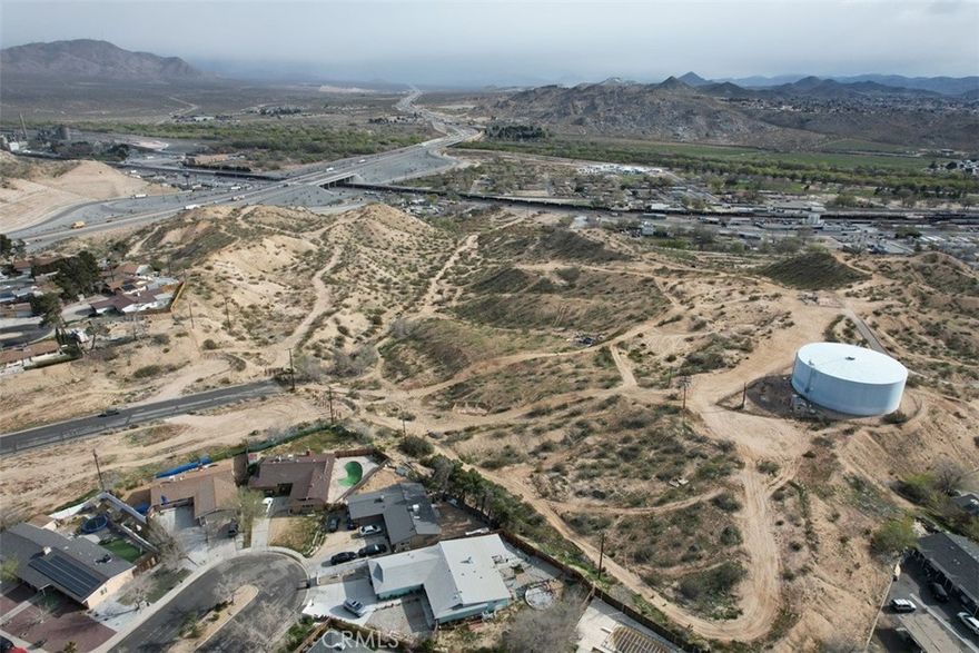 Major price reduction on this terrific +/-24-Acre Development Opportunity on busy D Street just east of I15 and the new D Street off ramp.  Awesome views from this large hillside parcel.  Now is the time to start acquisition and preparations for the next real estate upswing with the upcoming high-speed rail to Las Vegas.  Buy now and start development/entitlements or hold for possible future appreciation.  This rare parcel provides numerous possibilities.  Buyer to conduct their own Due Diligence with regard to zoning, land use and development.  Bring all Offers.