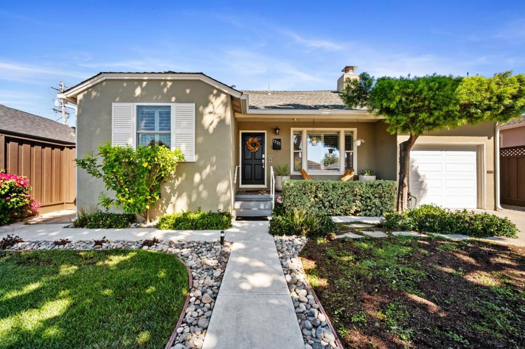 Discover the charm of this single-level rancher at 1225 Carlisle Drive, located in the desirable Sunnybrae neighborhood of San Mateo, CA. This inviting home offers 3 bedrooms and 2 bathrooms across 1,163 square feet of thoughtfully arranged living space. Step inside to experience an abundance of natural light that enhances the warm ambiance created by a cozy wood-burning fireplace and tasteful recessed lighting. The kitchen is equipped with sleek stainless steel appliances and quartz countertops, perfect for culinary enthusiasts. Adjacent to this is a formal dining room, ideal for hosting gatherings. Comfort is assured with central air conditioning and custom window treatments. The home sits on a 4,500-square-foot lot, featuring a super cute backyard that invites outdoor enjoyment. A spacious garage adds practicality, while the homes location on a picturesque tree-lined street offers excellent walkability. Proximity to a nearby park enhances this homes appeal, making it a serene retreat in a vibrant community. Embrace the opportunity to call this delightful property your own!