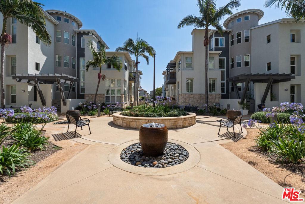 Available immediately! Check out this bright and airy 3-story Tapestry townhome featuring 2 bedrooms plus a versatile bonus den. This home spans approximately 2,140 square feet of thoughtfully designed living space. The layout includes a formal living room, family room, and dining area, as well as a private outdoor balcony for relaxing or entertaining. A cozy gas fireplace in both the living room and the primary suite adds warmth and charm. Dramatic soaring ceilings and oversized windows fill the home with natural light, while rich cherry hardwood floors enhance the main living areas. The upgraded kitchen showcases stainless steel appliances and ample cabinet space, combining function with style. Bedrooms are carpeted for comfort, and the primary suite offers its own retreat with fireplace and spa-like feel. Additional highlights include a private 2-car garage with EV charger, extra storage, and a quiet, interior-facing location. Rent includes water, trash, and security monitoring, plus membership to The Resort, just two blocks away, with its luxury pool and state-of-the-art fitness center. Enjoy access to 29 community parks, lush green spaces, and 24/7 security bike patrols. Walk to Playa Vista retail including Whole Foods, Cinemark, Free Market, Superfine Playa, Sol Cocina, SenderOne, Wild Child, Loqui, Blue Bottle, Tocaya Organica, Hopdoddy, Jack Henry, CVS, plus new retailers & restaurants coming soon! Playa Vista is home to these offices: Google, YouTube, Facebook, Yahoo!, The Honest Company, Tencent, Nike, 72andSunny, WeWork, Tia, Cedars Sinai and more.