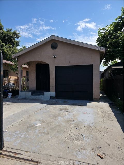 Photo of 10868 Weigand Avenue, Los Angeles, CA 90059 (MLS # IG25197712)