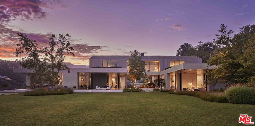 A brand new, contemporary Brentwood masterpiece, 2188 Mandeville Canyon Road is spectacular, striking and luxurious, while also warm, intimate and inviting. The masterful elements of detail, design and quality speak to the vision and creativity of the team, consisting of award-winning architect Noah Walker, AD 100 interior designer, Jamie Bush, and renowned landscape designer, Christine London LTD. With 6 bedrooms, 12 baths and nearly 19,000 SF of living space on 4 sprawling acres, this sophisticated modern havens offerings are unlike anything on the Westside. The immaculate grounds and bountiful amenities include a theater, gym, indoor lap pool, outdoor architectural pool, poolhouse, gardens, dual offices, outdoor living and dining room and detached guest house. Boasting 270-degree city, ocean and canyon views, this estate offers a uniqueness rarely found in Los Angeles, located moments from hiking and biking trails, shopping, dining and top-rated schools.