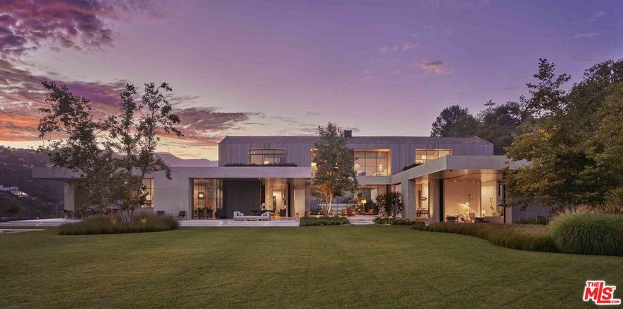 A brand new, contemporary Brentwood masterpiece, 2188 Mandeville Canyon Road is spectacular, striking and luxurious, while also warm, intimate and inviting. The masterful elements of detail, design and quality speak to the vision and creativity of the team, consisting of award-winning architect Noah Walker, AD 100 interior designer, Jamie Bush, and renowned landscape designer, Christine London LTD. With 6 bedrooms, 12 baths and nearly 19,000 SF of living space on 4 sprawling acres, this sophisticated modern havens offerings are unlike anything on the Westside. The immaculate grounds and bountiful amenities include a theater, gym, indoor lap pool, outdoor architectural pool, poolhouse, gardens, dual offices, outdoor living and dining room and detached guest house. Boasting 270-degree city, ocean and canyon views, this estate offers a uniqueness rarely found in Los Angeles, located moments from hiking and biking trails, shopping, dining and top-rated schools.