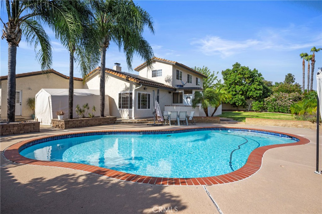 Where Comfort Meets Capability – Stunning 5-BEDROOM Oasis with POOL, RV PARKING & Endless Upgrades. Step into a home that truly has it all—a rare blend of refined interior comfort, outdoor freedom, and purposeful upgrades, all nestled within a beautifully maintained 5-BEDROOM, 3-BATH sanctuary spanning 2,420 SQ. FT. Designed for flexible living, the floor plan features a highly desirable MAIN-LEVEL PRIMARY SUITE with ENSUITE BATH—ideal for multi-generational households, added privacy, or long-term convenience. This home was clearly designed with real life in mind—thoughtful upgrades, smart features, and space to truly live in. From the moment you enter, you'll be greeted by the glow of OAK LAMINATE FLOORING (2024), the softness of plush NEW CARPET UPSTAIRS, and WALLS FRESHLY PAINTED from top to bottom in a timeless palette. The heart of the home features an upgraded STAINLESS STEEL REFRIGERATORS, INDUCTION COOKTOP (2022), and WHIRLPOOL DISHWASHER, designed for both beauty and functionality. Unwind in the spacious living area where a charming fireplace brings warmth and elegance, while UPDATED CEILING FANS keep the energy flowing throughout. This home offers more than a fresh start—it’s a comfortable, updated space you’ll love coming home to. But the true magic happens outdoors. Imagine hosting unforgettable summer nights in your professionally serviced pool, protected by a KATCHAKID SAFETY NET and enhanced by a new pool vacuum (2024). Lounge beneath the backyard gazebo, tend to your raised wood garden beds, or escape into the SHELTERLOGIC TARP SHED, perfect for storing quads, bikes, or weekend adventure gear. Need space for your toys? You've got it. With PERMITTED DRIVEWAY EXPANSIONS ON BOTH SIDES, this home easily accommodates RVs, boats, trailers, and more—including a custom paver wall, leveled gravel pad, and concrete apron on the east side. Additional highlights include: NEW ROOF IN SUNROOM (2024) and FULL SANDING AND REPAINTING, LIFTMASTER GARAGE DOOR SYSTEM (2021), and RADIANT LIFE 14-GALLON REVERSE OSMOSIS + WHOLE HOUSE FILTRATION SYSTEM. This is more than a home—it’s a lifestyle. A place where every upgrade was thoughtfully chosen, and every space invites you to live, explore, and thrive. Don't miss your chance to own this one-of-a-kind property—where dreams park in the driveway and memories are made by the pool.