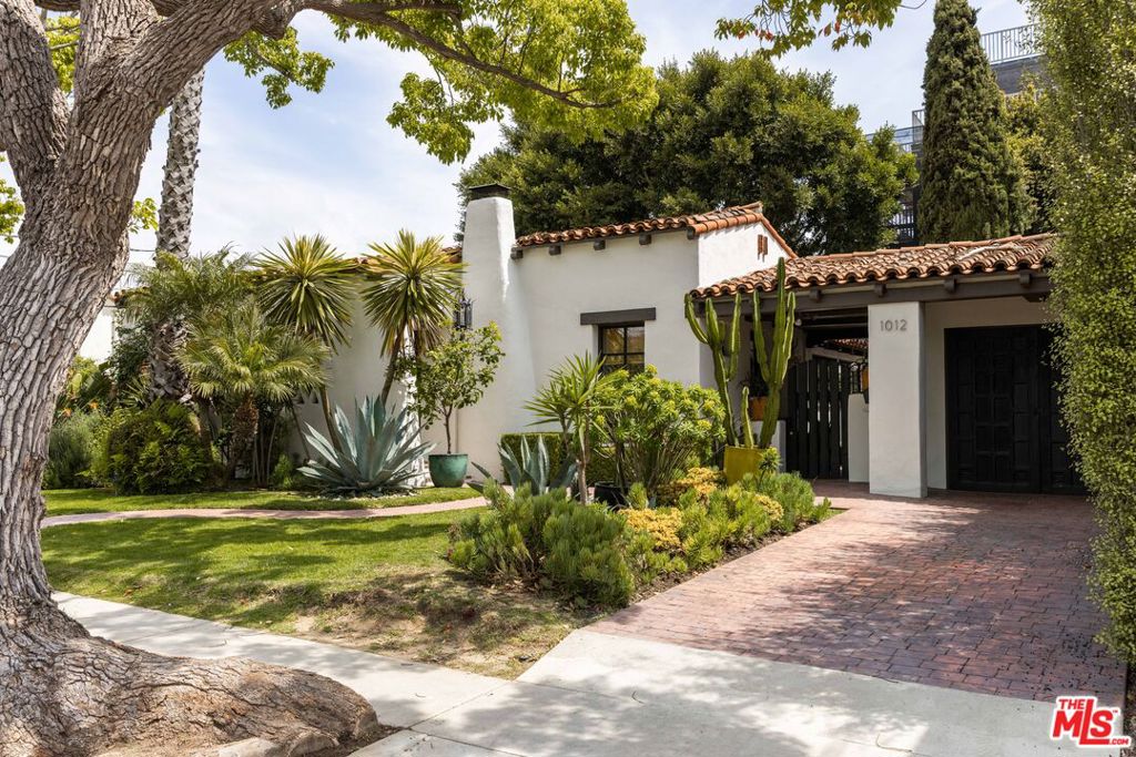 UNFURNISHED -Welcome to 1012 Superba Avenue, a stunning 1926 Spanish-style residence that beautifully marries original architectural details with modern upgrades. Nestled in the vibrant neighborhood of Venice, CA, this home offers a seamless blend of historic charm and contemporary living.Spanning 1,484 square feet, this two-bedroom, two-bathroom home showcases original wood beams and terracotta floors, preserving the character and elegance of its Spanish heritage. The refinished original hardwood floors further enhance the warmth and authenticity of this unique home.The new kitchen is a culinary masterpiece, featuring modern appliances and sleek design elements, while the cozy breakfast nook invites casual dining experiences. Both bathrooms have been cosmetically refined to offer modern comfort while maintaining the home's historic charm.Relax in the spacious living area, where a original fireplace serves as a captivating centerpiece, or step outside to enjoy the private outdoor space with a additional fire place perfect for entertaining or relaxing in the hot tub.Practical amenities include an in-unit washer and dryer, a new HVAC system for optimal climate control, and a tankless hot water heater providing endless hot water. The home is equipped with an alarm system and a sprinkler system to maintain the beautifully landscaped yard.The garage, which can double as a versatile flex space, offers additional options for parking, storage, or creative use. With parking included and the home offered unfurnished, this property is ready for you to personalize and make your own. 13 MONTH LEASE REQUIRED