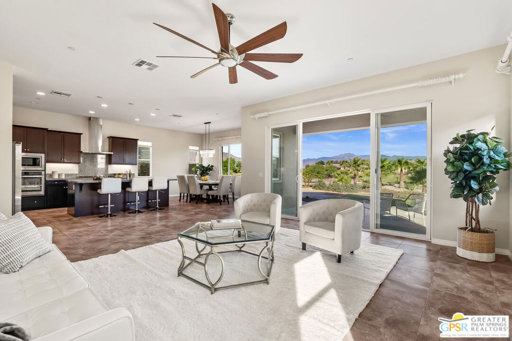 Desert Homes Realty presents resort-style living in the prestigious Desert Princess Palm Springs Resort in Cathedral City. There's a large sliding glass to enjoy the unbelievable, Panoramic, Mountain Views and the fully landscaped arroyos with almost 4 miles of walking paths; enhancing your enjoyment, exercise, views, and privacy. At 2,100 sq ft with 10" ceilings, this is the largest floor plan in the Arroyos neighborhood of Desert Princess Country Club. The large kitchen has an island with incredible quartz countertops that can be used as a breakfast bar or a social gathering with friends. The appliances are all high-end, including a gas cooktop, electric oven, microwave, garbage disposal. Features like custom cabinetry, tiled living area floors, carpeted bedrooms & modern interior ceiling fans with lights throughout to complete this contemporary home.This modern & highly customized 3-bedroom home has 3.5 baths. Each of the 3-bedrooms features its own private bathroom and walk in closets for optimal comfort and convenience. Each shower was designed with custom tiles and hardware. An additional half bath ensures that your guests feel welcomed and pampered.This home includes an inside laundry room, tankless hot water heater, wall remote-controlled fireplace, large garage with a separate area to park your golf cart inside. HOA DUES INCLUDE: Access to an impressive array of amenities in this gated community, including: 35 community pools/spas, 24-hour security guard at the front gate, membership to Health and Fitness Center, Tennis, Bocce ball and Pickle ball courts, and discounts at the clubhouse grill dining room, masters lounge, pro shop, and locker rooms with preferred tee times at the golf club. The Desert Princess has an affordable 27-hole PGA Championship golf course, no Tee-time lotteries, no initiation fees, rated among the best in the valley by GOLF DIGEST. The HOA Fees also provide maintenance of your front and back yards by HOA ground crews, outside pest control when requested, outside landscape water, (you pay only for inside water), 2 DVR/HD Spectrum Cable boxes, as well as High Speed Internet. Tenant pays Utilities (electric, gas & water). This home offers elegance and leisure as a primary home, or secondary home.