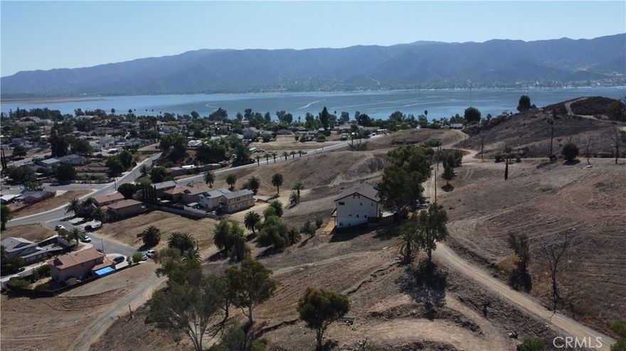 Great Opportunity to build your dream home in a great part of the Lake Elsinore community.  Three, yes 3, contiguous parcels are for sale, with water and electricity close by.  This property is ideal due to its proximity to Lake Elsinore and all of its amenities such as fishing, boating, water sports, and camping sites.  For a future family, located within 1 mile are Ortega High School, Elsinore Middle School, and Elsinore Elementary School.  Close access to I-15 freeway, gives a commuter less time on the road to/from their destination.  For you developers and investors, the home 2 parcels away, built in 1990, sold for $420k in 2021.  Come and build and enjoy this hidden gem! (Boundary lines drawn are approximations)
