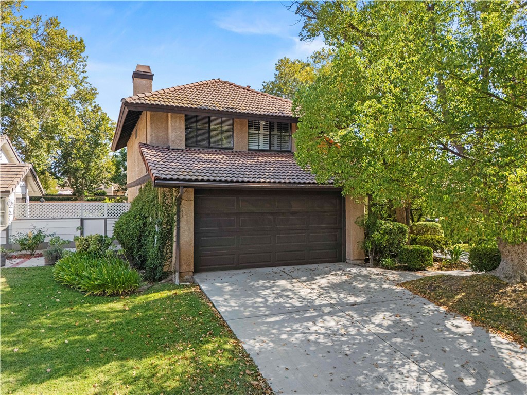 Beautiful POOL home in one of Valencia's highly desired neighborhoods! Nestled on a quiet cul-de-sac in the coveted community behind Granary Square, this 3-bedroom, 2.5-bath home offers the perfect mix of charm, comfort, and style. Step inside to soaring vaulted ceilings in the entry and a flowing, light-filled floor plan that’s perfect for everyday living or hosting guests. The kitchen features granite countertops, ample cabinetry, and an easy connection to the dining and living spaces for effortless entertaining. Upstairs, you’ll find all three bedrooms, including a spacious primary retreat with a beautifully updated ensuite bath. The additional upstairs bath is tastefully appointed and conveniently serves the secondary bedrooms. Outside, enjoy a sparkling pebble tech pool, generous patio space, and a backyard that’s perfect for relaxing or summer gatherings. FULLY OWNED SOLAR and newer oversized HVAC keeps energy costs low, adding even more value. Close to parks, paseos, shopping, dining, schools, and easy freeway access, this home offers the lifestyle you’ve been dreaming of in one of the most sought-after neighborhoods in the area. Absolute must see!