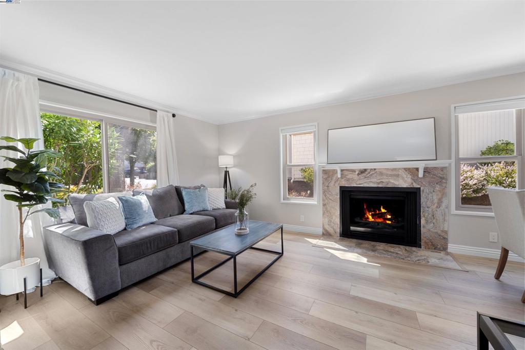 Transparently priced combined with lower interest rates available — making this private retreat easy to call your own! Tucked away in one of Moraga’s most desirable communities, this beautifully remodeled end-unit townhome lives like a private single-family residence. Inside, enjoy thoughtful upgrades throughout: luxury vinyl plank flooring, plush bedroom carpeting, designer lighting, and a reimagined kitchen with white shaker cabinets, stone counters, and premium stainless steel appliances. The open living and dining area, anchored by a cozy fireplace, flows seamlessly to a sunlit patio—perfect for coffee or dining al fresco. A chic half bath completes the main level. Upstairs, two spacious bedrooms offer sweeping views of rolling hills and treetops, views. The full bath offers dual vanities, and a laundry closet adds everyday ease. Extras include a newer HVAC, dual-pane windows, three storage units, and two covered parking spaces. HOA covers pool, water, garbage, and exterior maintenance. Major roof and siding upgrades are already paid for, ensuring peace of mind and lasting value. Close to trails, Orinda BART, top-rated schools, St. Mary’s, and Moraga’s shops and dining—this home truly has it all.