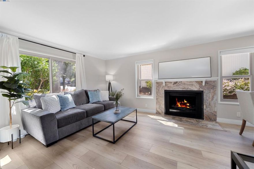 Transparently priced combined with lower interest rates available — making this private retreat easy to call your own!  Tucked away in one of Moraga’s most desirable communities, this beautifully remodeled end-unit townhome lives like a private single-family residence. Inside, enjoy thoughtful upgrades throughout: luxury vinyl plank flooring, plush bedroom carpeting, designer lighting, and a reimagined kitchen with white shaker cabinets, stone counters, and premium stainless steel appliances.  The open living and dining area, anchored by a cozy fireplace, flows seamlessly to a sunlit patio—perfect for coffee or dining al fresco. A chic half bath completes the main level. Upstairs, two spacious bedrooms offer sweeping views of rolling hills and treetops, views. The full bath offers dual vanities, and a laundry closet adds everyday ease.  Extras include a newer HVAC, dual-pane windows, three storage units, and two covered parking spaces. HOA covers pool, water, garbage, and exterior maintenance. Major roof and siding upgrades are already paid for, ensuring peace of mind and lasting value.  Close to trails, Orinda BART, top-rated schools, St. Mary’s, and Moraga’s shops and dining—this home truly has it all.