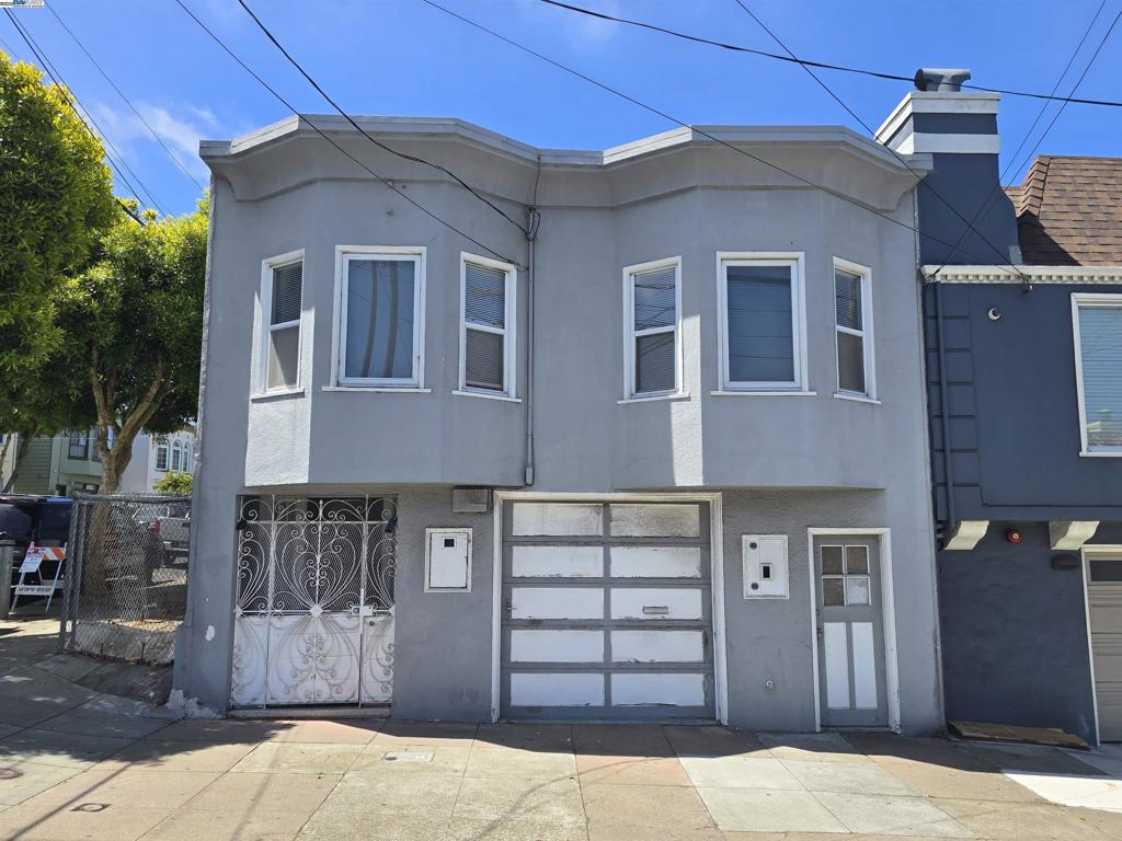 Impressive opportunity for developers or savvy investors! This property features a 3-bedroom, 2-bathroom home with 1,420 sqft of comfortable living space. The total lot size is 3,900 sqft and offers excellent versatility with two separate parcels, enhancing future development potential. Being a corner lot, the house faces two different streets with seperate access areas. Highlights include a spacious 4-car garage located behind the main house, plus an additional 1-car garage integrated on the lower level of the main residence—ideal for car enthusiasts, extra storage, or workshop space. The layout and lot configuration present strong possibilities for adding another home or a multi-unit apartment building (buyer to verify with city/county guidelines). This is a rare chance to purchase two parcels together—perfect for adding value through new construction or expansion. Unlock the full potential of this unique property for maximum returns.