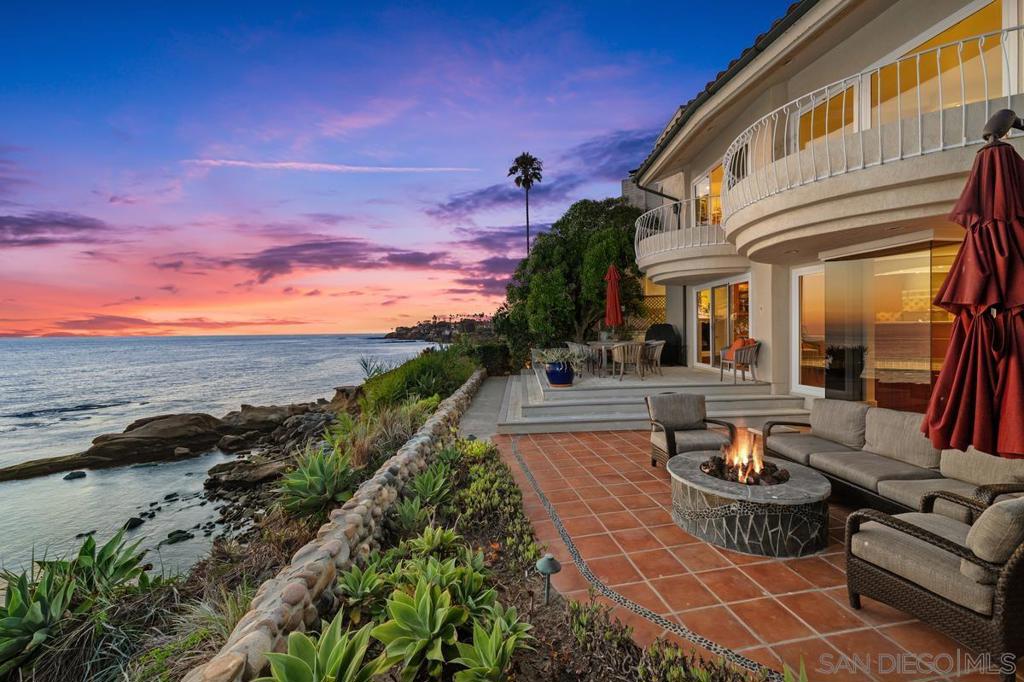 Perched on the oceanfront directly across from the iconic “Bird Rock,” this exquisitely charming home blends an unmatched location with timeless style and grace. Sunlight pours through every room, illuminating stunning sunset views over the water. Enjoy refreshing ocean breezes from your private courtyard, designed for effortless indoor-outdoor entertaining. Just a short stroll to top restaurants, boutique shops, and highly rated schools, the home also offers quick access to the nearby pedestrian stairs leading to the shore—close enough to enjoy the surf, yet private enough to feel like your own sanctuary. A rare offering in one of La Jolla’s most coveted settings.
