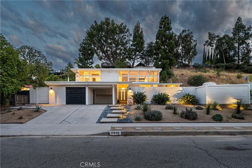 Stunning Mid-Century Modern home echoing the iconic Eichler architecture in the highly desirable Balboa Highlands community.  One of the largest and most striking models, this modern architectural gem features an open floor plan that seamlessly connects indoor and outdoor living—perfect for entertaining and everyday relaxation.



The home offers 5 spacious bedrooms, including two primary suites (one on each level), each with spa-like baths and large walk-in closets. The gourmet chef’s kitchen opens to a casual dining area and spacious living space. Upstairs, a large family room or home theater showcases beautiful mountain views.



Enjoy this private oasis complete with a sparkling pool and multiple areas for lounging and dining as well as drought-resistant desert landscaping. Conveniently located near top-rated schools, easy freeway access, and O’Melveny Park with its scenic hiking trails. A rare opportunity to own a true mid-century modern masterpiece in one of the Valley’s most sought-after neighborhoods.
