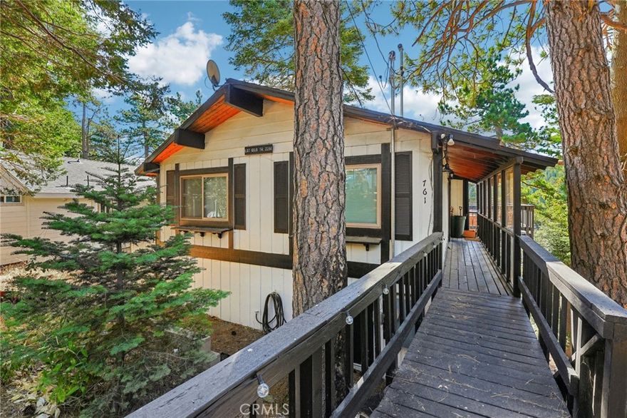 Operating Airbnb! Charming Income-Producing Mountain Retreat in Prime Location! Just minutes from Lake Arrowhead Village, SkyPark at Santa’s Village, and only 90 minutes from Los Angeles and Orange County, this 3-bedroom, 2-bath home offers the perfect blend of peaceful seclusion and easy accessibility. Designed for both relaxation and entertainment, the home features two bedrooms and one full bath upstairs, and one bedroom and one full bath downstairs—ideal for guests, multi-generational living, or potential duplex use with its separate lower-level entrance. Cozy fireplaces on both levels create the perfect mountain ambiance for year-round enjoyment. Step out onto the spacious deck and enjoy the serene mountain air, surrounded by lush forest views and distant city lights. It's the perfect place to unwind after a day of hiking, skiing, or lake activities. Inside, large sliding doors bring the outdoors in, and a pool table downstairs adds to the entertainment options. The main entry is protected by a plexiglass enclosure for convenient winter access without compromising the view. Whether you're looking for a private mountain getaway, an income-producing vacation rental, or a bit of both—this property is ready to deliver. Don’t miss your chance to own a piece of Lake Arrowhead charm with proven rental potential and rave guest reviews!