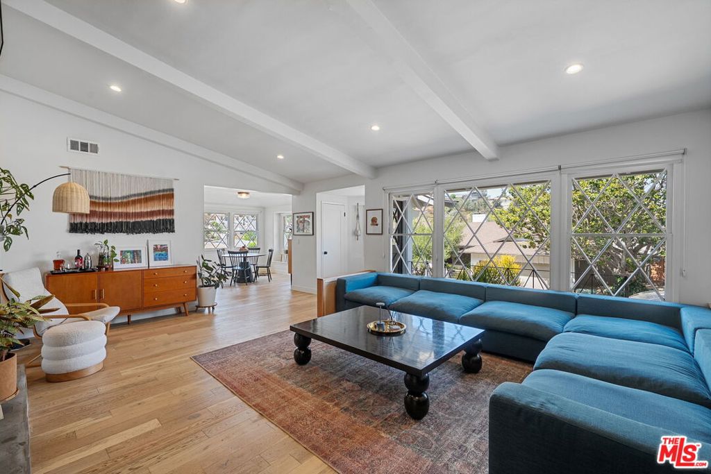 Located in the coveted Don streets in Baldwin Hills Estates, this light filled 3 bedroom, 2 bathroom home welcomes you with sweeping views of the Hollywood Sign, Griffith Observatory, and the iconic downtown skyline. Soaring ceilings and a bright, open floorplan create a sense of peaceful spaciousness, beautifully accented by natural white oak hardwood flooring. The updated kitchen is a dream for both cooking and entertaining, featuring stainless steel appliances, custom shaker cabinetry, Delta fixtures, and crisp white quartz countertops. The layout flows seamlessly into a private backyard oasis, accessible from the kitchen, guest, and primary bedrooms. Designed for true indoor/outdoor living, the backyard offers a beautiful teak deck, a large flat turf lawn, and a terraced garden, perfect for hosting outdoor get togethers with the built in BBQ, working out, relaxing in the sun, or simply enjoying the serene surroundings. The resort style primary suite boasts a pitched wood ceiling, walk-in closet, updated en suite with stylish cement tile, and dual sliding glass doors that open directly to the backyard retreat. The oversized 2.5 car garage includes an extra storage area and offers plenty of room for multiple vehicles, a home gym, workshop, or office. Baldwin Hills Estates is one of L.A.'s most desirable neighborhoods, known for its warm community feel, dramatic hilltop views, and unbeatable central location, just minutes from Culver City, SoFi Stadium, dining, shopping, and entertainment. This is a rare opportunity to own a move-in ready home that offers resort style living, exceptional privacy, and a true connection to the best of Los Angeles.
