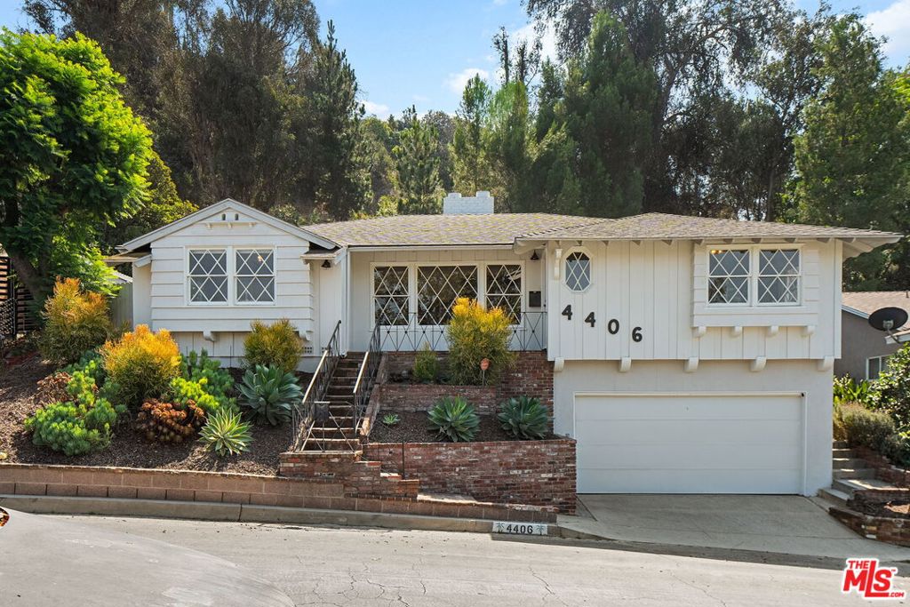 Located in the coveted Don streets in Baldwin Hills Estates, this light filled 3 bedroom, 2 bathroom home welcomes you with sweeping views of the Hollywood Sign, Griffith Observatory, and the iconic downtown skyline. Soaring ceilings and a bright, open floorplan create a sense of peaceful spaciousness, beautifully accented by natural white oak hardwood flooring. The updated kitchen is a dream for both cooking and entertaining, featuring stainless steel appliances, custom shaker cabinetry, Delta fixtures, and crisp white quartz countertops. The layout flows seamlessly into a private backyard oasis, accessible from the kitchen, guest, and primary bedrooms. Designed for true indoor/outdoor living, the backyard offers a beautiful teak deck, a large flat turf lawn, and a terraced garden, perfect for hosting outdoor get togethers with the built in BBQ, working out, relaxing in the sun, or simply enjoying the serene surroundings. The resort style primary suite boasts a pitched wood ceiling, walk-in closet, updated en suite with stylish cement tile, and dual sliding glass doors that open directly to the backyard retreat. The oversized 2.5 car garage includes an extra storage area and offers plenty of room for multiple vehicles, a home gym, workshop, or office. Baldwin Hills Estates is one of L.A.'s most desirable neighborhoods, known for its warm community feel, dramatic hilltop views, and unbeatable central location, just minutes from Culver City, SoFi Stadium, dining, shopping, and entertainment. This is a rare opportunity to own a move-in ready home that offers resort style living, exceptional privacy, and a true connection to the best of Los Angeles.
