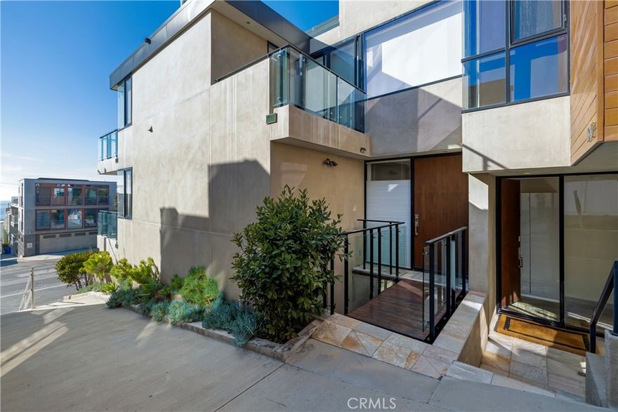 UNBELIEVABLE OCEAN VIEWS!  Experience the ultimate in coastal luxury living with this west-facing, fully furnished high-end townhome located in the heart of downtown Manhattan Beach, just steps from the sand and vibrant shops and restaurants.

The top floor features an open-concept layout with a custom gourmet chef’s kitchen, fully equipped with stainless steel appliances and a sleek breakfast bar. The adjoining dining and living areas offer unobstructed white-water views stretching from the Palos Verdes Peninsula to Malibu, including a front-row view of the iconic Manhattan Beach Pier. On cool ocean-breeze evenings, gather around the cozy fireplace or slide open the floor-to-ceiling glass doors to step onto the outdoor patio — the perfect spot to soak up the Southern California sun or take in breathtaking sunsets.

A separate office and bonus area provide a versatile space ideal for working from home, complemented by a convenient powder room.

The second floor boasts a luxurious primary suite with a spacious bedroom and spa-like bathroom featuring both a soaking tub and separate shower. A second bedroom offers floor-to-ceiling closets, an en-suite bath, and access to a private patio.

On the bottom floor, you’ll find a second private master suite with a large bathroom, tiled shower, and bathtub, along with a dedicated laundry room offering ample storage space.

Property highlights include:

• Sweeping panoramic ocean views

• Walnut hardwood floors & custom-designed cabinetry

• High-end tile, Caesarstone counters, and modern fixtures

• Central A/C

• Two-car garage plus two additional parking spaces

Furnishings: The property can be leased unfurnished or fully furnished with the stylish pieces featured in the photos.

This rare offering combines high-end finishes, thoughtful design, and a premier location — the very best of Manhattan Beach coastal living.