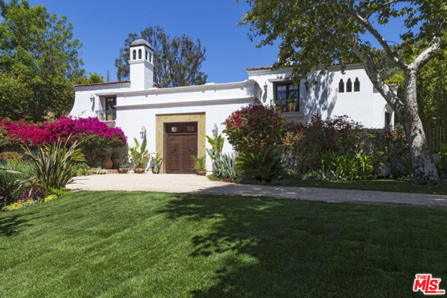 Casa Miraflores. Majestically sited on over half an acre in the prestigious Riviera, this magical Richard Landry Mediterranean on the Amalfi rim provides sweeping sunset VIEWS across the canyon. Circular driveway leads to a massive entry courtyard and three story interior entry, providing the ultimate in privacy. Every room invites the cool ocean breezes with balconies, walled courtyards, disappearing doors maximizing the restorative views and peaceful poolside gardens. Massive great room leads to romantic fireside loggia. Chef's "double" kitchen, wonderful home office, separate guest suite, studio, media room, and much more. Architectural details and wondrous use of tile, Venetian plaster, sumptuous woods and stone create a sense of luxury, comfort and chic. Featured in Architectural Digest, Casa Miraflores won countless design awards including the Grand Gold Nugget for Custom Homes, LA Magazine Design House of the Year. Meredith Baer Staging.