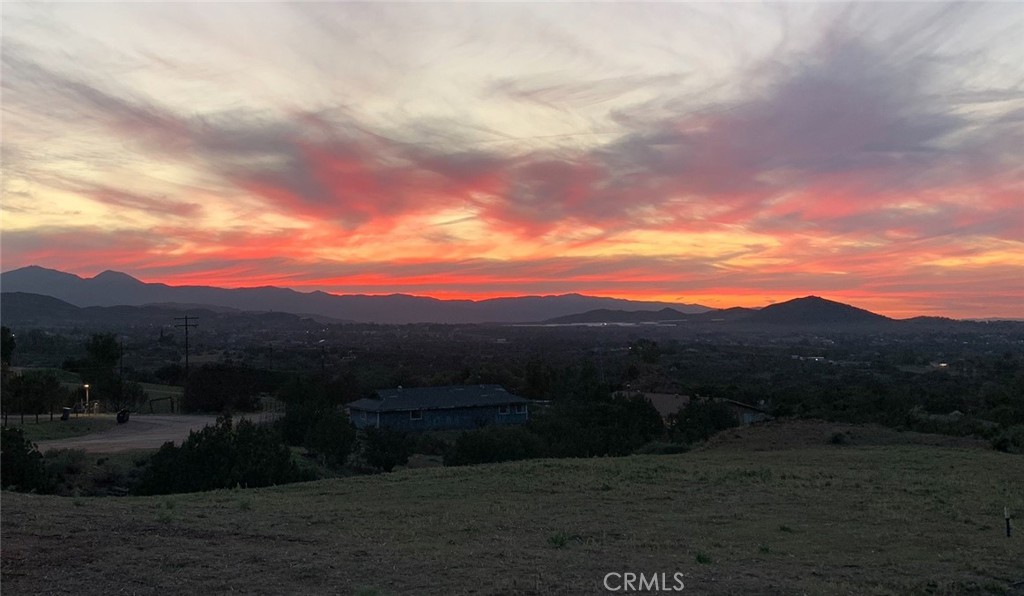Billion-Dollar Views on 9.5 Acres – Gavilan Ranch, Perris/Lake Mathews Area. Enjoy sweeping 180-degree views of the stunning countryside from two prime home pads—whether it’s your front door, back patio, kitchen window, or a future gazebo, every angle delivers breathtaking scenery. Located in the tranquil hills of Gavilan Ranch, this 9.5 acre parcel sits in a well-established, horse-friendly community where each neighboring property averages 4 acres. Peaceful, spacious, and private—ideal for building your dream estate. The only lot with these views. 19206 Niro Rd, Perris 92570.
Property Highlights:
Two home pads – both with panoramic views.
Build 2000 Sq.Ft. single story home or a larger two story on pad 1
Recently drilled water well + 3,000 gallon storage tank.
Reliable water supply for home use and irrigation.
Area zoned for horses – perfect for equestrian living.
Electricity available at the street.
Included is She shed / Man Cave and 40 foot container.
Plenty of space for fruit trees, a vegetable garden, or a private orchard. Build the lifestyle you want—whether that means a custom home or two, barn, work shop, warehouse, garden, or all of the above. With views like this, every sunrise and sunset is a show.
