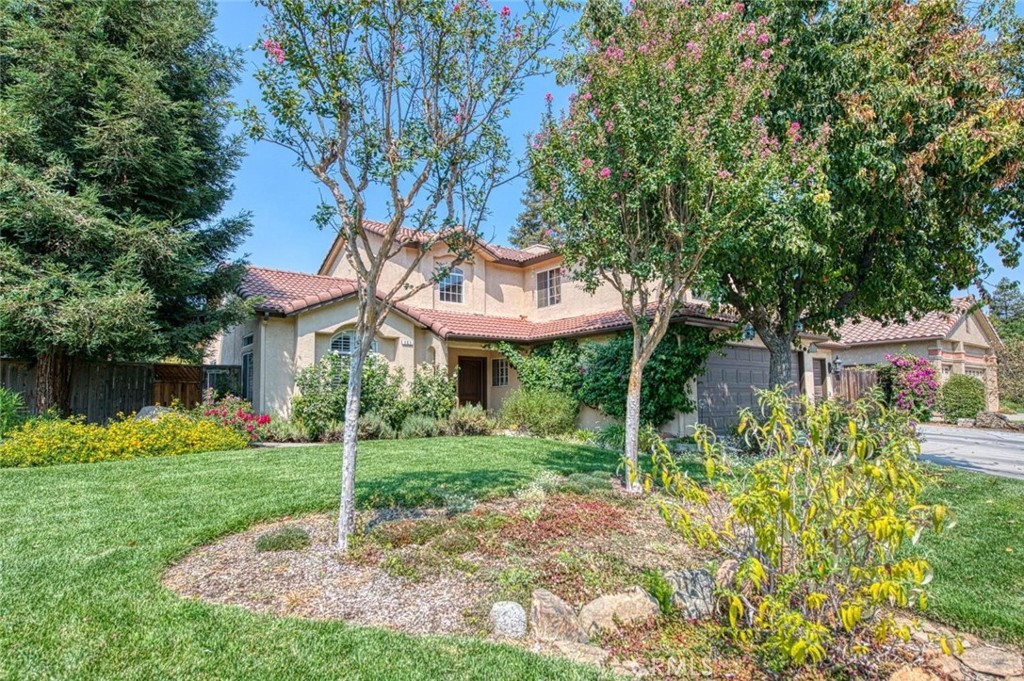 This 4-bedroom, 3-bath home in the sought-after Buchanan School District offers a spacious and inviting layout. The open floorplan includes formal living and dining rooms plus a remodeled kitchen with a 5-burner gas cooktop, double ovens, built-in microwave, soft-close shaker cabinets, subway tile backsplash, floating shelves, breakfast bar, and dining nook overlooking the backyard. Upgrades include shutters, a whole house fan, and dual-zone HVAC. The floorplan features an isolated bedroom with full bath downstairs, a spacious primary suite upstairs, laminate flooring throughout, a stone fireplace, and excellent storage options, including a finished Tuff Shed. The large 9,350 sq ft lot provides RV access, a 3-car garage, and mature landscaping with fruit trees including lemon, apricot, persimmon, fig, and stone fruits. A covered patio and refreshing pool complete the backyard retreat. Located on a quiet street near parks, trails, shopping, and the Buchanan Educational Complex just around the corner.