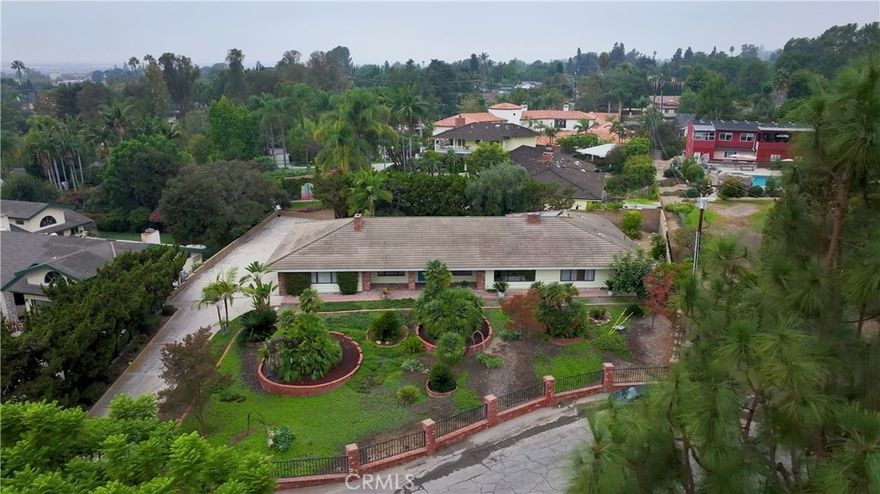 This exceptional single level residence is custom built at the end of a peaceful cul-de-sac in the highly sought-after Friendly Hills community. Featuring a 151-foot of yard frontage that is secured by wrought iron and brick fencing. A 20,034 sq.ft lot that has luscious greens in front of the large 3,107 sq.ft. enchanted 4 bedroom, 4 bath home which is perfectly designed. This residence is comfort, functionality and has a fantastic open floor plan that stands apart from standard builds.



Enter and enjoy the parquet wood floors and tall ceilings thoughout this entertainer’s home. The formal living room is large, 22' X 19' with a centered  fireplace and a built-in tall mirror. The dining room, 15.5' x 16.5' has tall ceilings, that connect seamlessly to the backyard through sliding glass doors, filling the home with natural light. The kitchen is classic Hawaiian style, all wood cabinets designed to fit, a barn style sink, a dishwasher, trash compactor, an induction 6 burner stove, dual ovens, a pantry, a refrigerator, and desk for your recipe book. The large family room, 31' x 19',  has soaring tall wood beamed ceilings, big windows, a walk-up wet bar, a cozy second fireplace. This home is perfect for hosting and entertaining friends and family. 



The large primary suite has soaring ceilings, fits a king size bed and a sitting area, a walk in closet and the large windows bring in morning light. A spa-like ensuite bathroom Corian counters, dual sinks, a shower, a sit-down jet tub, the perfect retreat after long days. The other three bedrooms are generously sized and feature updated lighting and flooring with good size closets. Two of the bedrooms have access to the backyard and share a bathroom with dual sinks, Corian counters and a shower. Find the 4th bedroom with a 2nd ensuite bathroom, Corian counters and a shower. Car enthusiasts and hobbyists will fall in love with the expensive four-car garage, complete with built-in cabinets, abundant storage, a workshop bench, and even its own bathroom. The garage connects directly to the house and backyard. Exterior paved areas, offering to easily fit your RV, boat and jetskies plenty of parking, or use as the perfect basketball /pickleball court for family fun. Find mature fruit trees, a yard great for birthday parties, and weekend barbecues. Just minutes from Friendly Hills Golf Course, take your golf cart from your new home, into the golf course. Enjoy a Brand New Central AC/HVAC 5 ton with warranty.