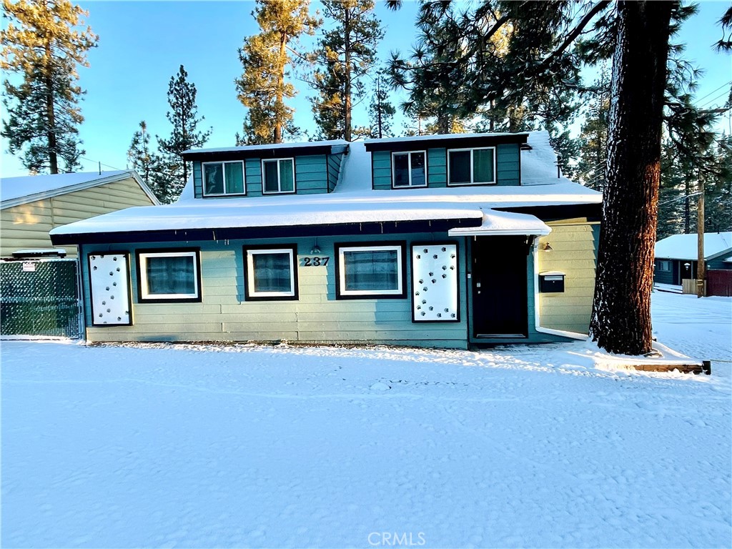 Welcome home to one of Big Bear’s most desirable neighborhoods of Forest Springs, just minutes to the lake, trails, and Big Bear Village. 237 E Big Bear Blvd blends style, flexibility, and income potential. Formerly a sign-printing shop, the property was thoughtfully converted to residential use in 2021 with quality upgrades throughout. Today, it operates as Black Bear Bunker, a successful short-term rental/Airbnb (Superhost & “Guest Favorite,” per Airbnb). The property has easy access and ample private parking. Appliances and many of the furnishings are included. Step inside and indulge in the warmth of wood beams and stylish touches. The updated kitchen is designed with custom cabinetry, snow-white quartz counters, breakfast bar, and new custom lighting. Living room has dimmable recessed lighting and a cozy gas fireplace with elevated brick seating.The two upstairs bedrooms have charming dormers while the downstairs bedroom has fun barndoors. Office room. Bedrooms feature Helix and Linen spa ultra-plush mattresses. Both baths are remodeled. Another wonderful feature is the lounge area with custom-made ski/snowboard rack and pass-thru window to the kitchen, expanding your hangout space, Inside laundry room. Infront parking for 3 vehicles and side parking for 2 vehicles. The detached two-car garage has been converted into a speakeasy-style game room—perfect for memorable Big Bear escapes boasting a stunning chandelier and elegant pool table. Outside, the fully fenced yard is strung with solar lights and dialed for year-round entertaining: a relaxing hot tub for stargazing, an 8-person bar-height gas firepit-table under a large pergola for year-round enjoyment, gas BBQ, picnic table, hammock, life-size Connect 4, and additional yard games. Close to Hwy 38 for an easy down-the-mountain commute, yet convenient to hiking/biking, Big Bear Lake, and all the mountain has to offer. Investment & Use Flexibility: Per seller, the location along the Blvd offers optional business/office visibility; the property has previously operated commercially before the 2021 residential conversion. Buyers to verify zoning, allowable uses, STR permitting/licensing, and any transferability/occupancy limits with the applicable local authority (San Bernardino County). Ask about the buyer insentives! Whether you are buying your vacation home, making a move to Big Bear or looking for your new investment, this home is move-in ready and fully stocked. Start your new chapter call today.