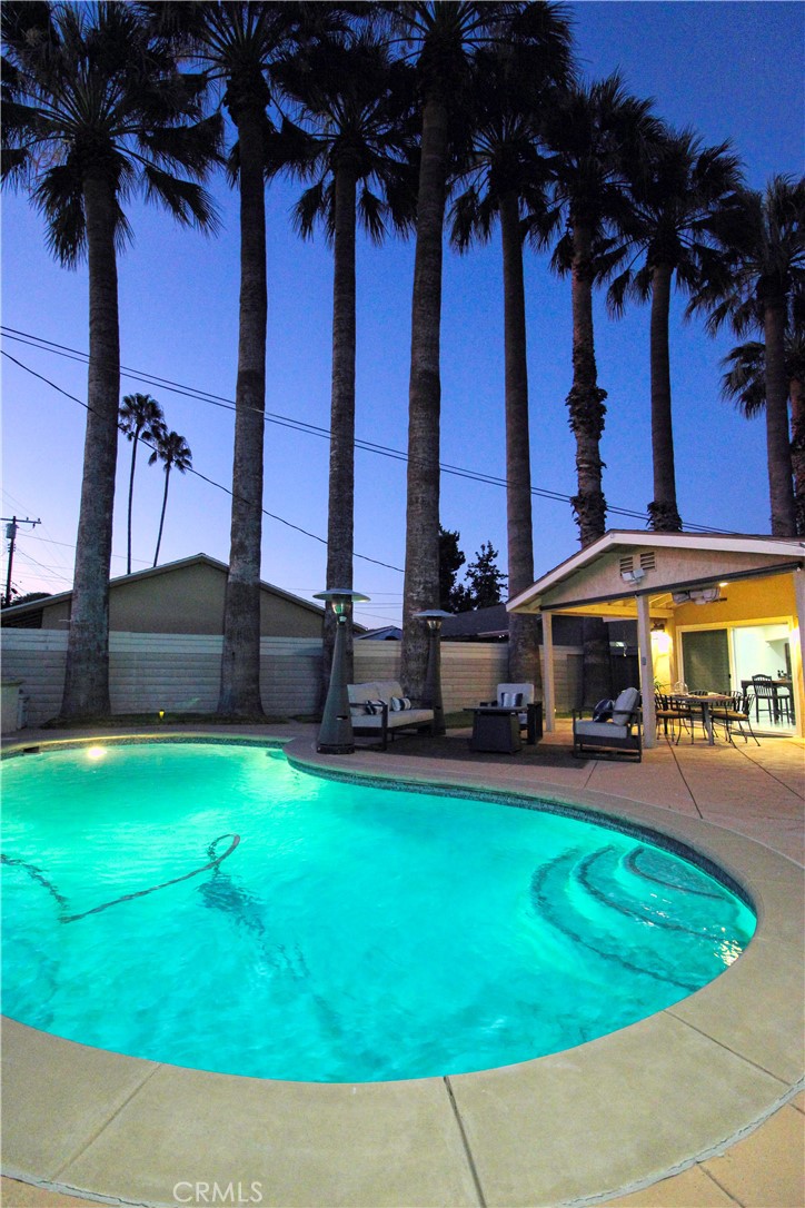 California living at its best! This beautifully updated home offers the perfect blend of relaxation and entertainment. Enjoy a sparkling pool, built-in BBQ with natural gas connection, stamped concrete patio, and a covered outdoor dining area all in a resort like atmosphere. The open-concept kitchen features an oversized granite island, recessed lighting, and direct flow to the living and dining areas. The expansive primary suite, converted from two bedrooms, has room for a nursery or home office along with two additional well-appointed bedrooms Elegant finishes include travertine flooring, custom shutters, and a gas fireplace. Spa-inspired bathrooms feature a jetted soaking tub and a walk-in shower. Upgrades include new dual-pane windows, sliding doors, a new 4-ton HVAC System with heat pump for efficient year-round comfort and a wireless ADT alarm system. This home offers a perfect blend of comfort, style, and privacy in a sought-after West Hills neighborhood. Call me for a private tour. Act now!