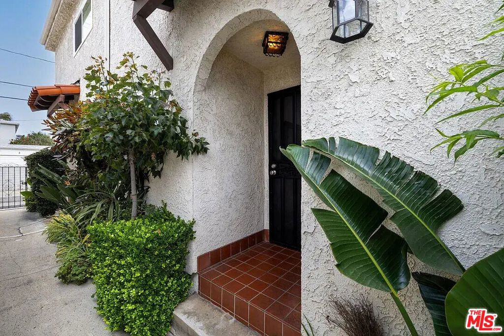 Fully-Furnished (or unfurnished) two-level Townhouse with two bedrooms plus two full bathrooms upstairs, and one half bathroom on the first floor. Recently-updated light gray hardwood floors throughout. Beautifully renovated, sunny and bright 2BR/2.5BA townhouse with living-room extension - niche that can be used as a home-office. Located in central Santa Monica. Remodeled kitchen with contemporary, soft gray cabinets, quartz counters, a breakfast bar and stainless steel appliances. Tons of storage and expansive counter space, this modern kitchen is open to the main living and dining areas. Lots of sun from sliding glass doors opening onto a main level exclusive patio, large enough for a grill, full-sized table/chairs and more. Living room with gas fireplace, wet bar converted to office nook. Plenty of space for computer and files, and doors close when work is done! Spacious main BR upstairs with high ceilings, amazing light, and walk-in closet. En-suite main bath with 2 sinks and step-in shower. 2nd BR with beautiful views, additional remodeled full bath. 2-car side-by-side parking with Electrical Vehicle (EV) hookup in gated garage, two guest parking permits for plenty of street parking, full-sized laundry inside, newer central HVAC. HOA dues paid by Landlord and include EQ insurance. What an easy place to call home!