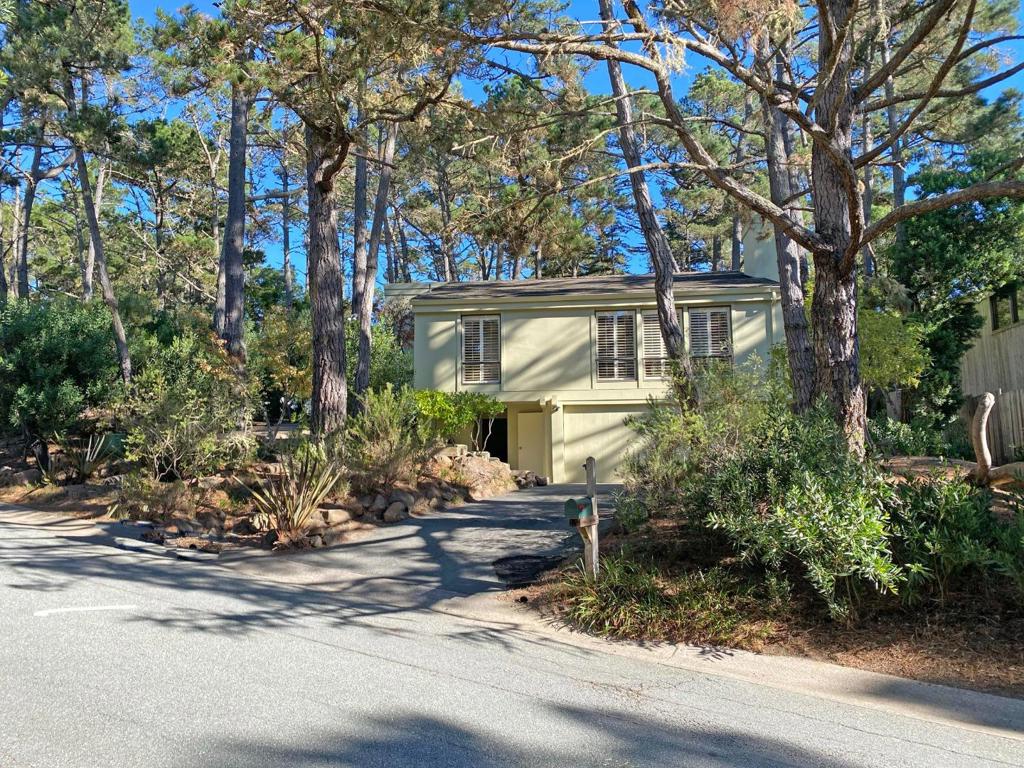 A great opportunity to live in Pebble Beach at an affordable price! This single story home sits on a large forested corner lot, conveniently located on the upper side of Pebble Beach within easy proximity to the Highway 1 gate. The living room features soaring ceilings with oversized windows looking out to Del Monte forest. The home is move in ready, or an opportunity to update or expand. Per the water board, there are water credits for an additional bathroom available after water conservation retrofits have been completed.