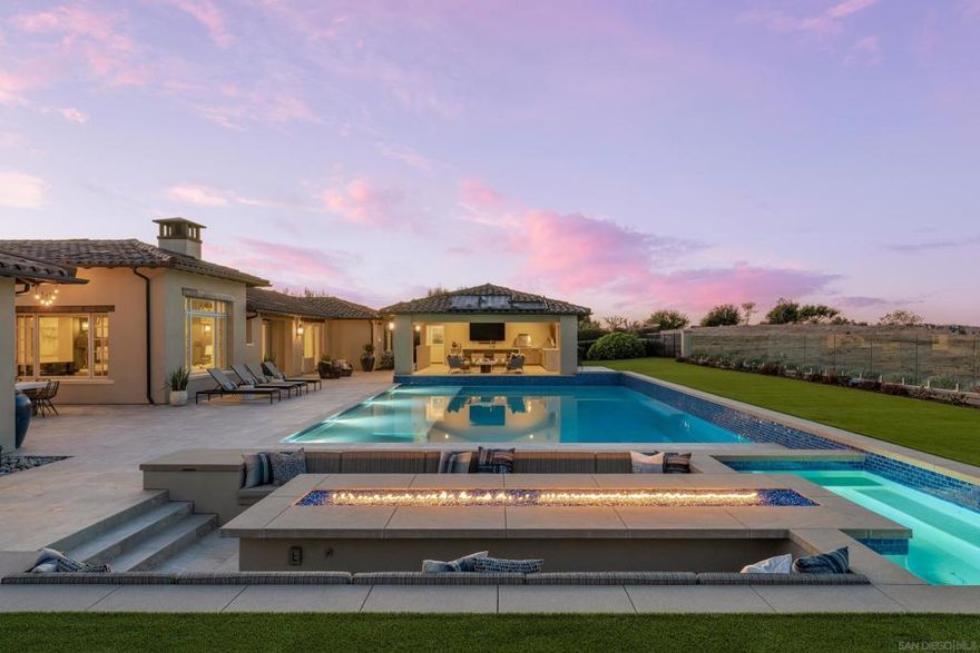 Welcome to a mint one-of-a-kind single-level estate in the exclusive, guard-gated community of Santa Luz. Perched atop on one of the most premier view lots in this renowned golf course community, this home offers breathtaking panoramic views to the east and west. Completely reimagined over the years to blend the modern indoor outdoor luxury lifestyle.  The chef’s kitchen is a culinary dream, boasting premium appliances, custom cabinetry, Built-in wine refrigerator and sophisticated finishes.  Every bathroom has been thoughtfully updated with spa-inspired design, high end flooring throughout the home adds a fresh, contemporary touch. For guests or extended family, the incredible private suite is perfect, offering comfort and seclusion—an ideal in-law retreat.  The backyard is the ultimate entertainer’s paradise. The custom-built cabana with a full bath and storage area, built-in heaters, a spacious island with additional seating, custom cabinetry for seamless organization, a Sub Zero Fridge, high-end BBQ, pizza oven, and dishwasher. The brand-new pool/spa serves as the focal point of the outdoor space, surrounded by elegant pavers, lush landscaping and huge sunken firepit. Whether you’re hosting gatherings or enjoying tranquil evenings under the stars, this backyard has everything you need for year-round luxury living.  Finished 4 Car Garage with Built in cabinets, parking for multiple car in the huge driveway, Solar Owned  This extraordinary estate perfectly blends sophisticated design, thoughtful amenities, and outdoor living, making it one of the finest homes in Santaluz.