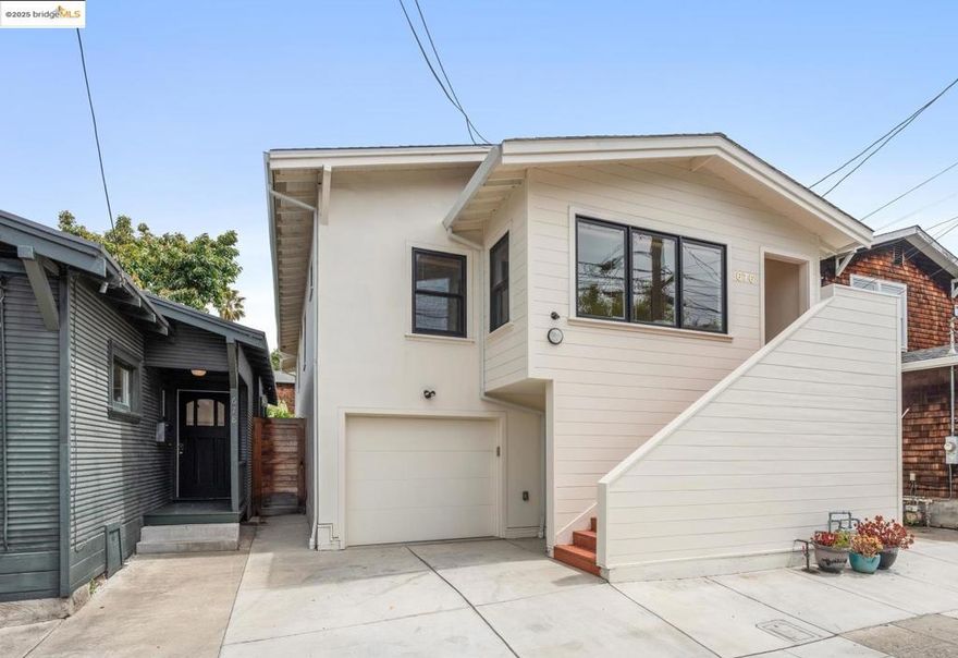 Fully vacant and located in the vibrant Longfellow neighborhood of North Oakland, this rare triplex offers three separate dwellings across two houses—just blocks from MacArthur BART, locally owned restaurants, cafés, and shops. It's the perfect “house-hack”: live in one unit and rent the others, or create a flexible multigenerational compound. The main white house at 676 was extensively renovated in 2018 with all-new systems including foundation, plumbing, electrical, and HVAC. The upper unit is a spacious 2-bedroom, 1.5-bath home, and the lower level is a separate 2-bedroom, 1-bath unit—both with modern kitchens, updated bathrooms, and in-unit laundry. Use them independently or combine them into one larger residence via the internal staircase. The detached 1-bedroom, 1-bath cottage at 678 offers even more flexibility—perfect for rental income, guests, or a dedicated home office. Set among mature, drought-tolerant landscaping, this turnkey property delivers comfort, versatility, and location in one of Oakland’s most exciting neighborhoods.