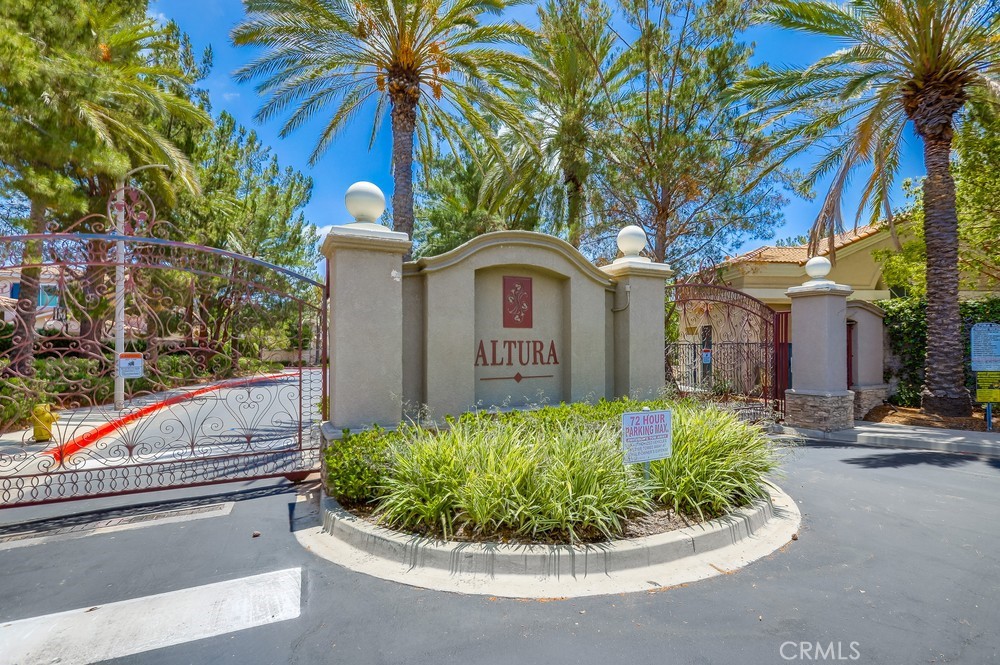 This 2 Bedroom, 2 Bath condo is located in the desirable gated Altura Community! Relax by the cozy fireplace in the living room or on the deck after a long day. The kitchen has been upgraded with white granite countertops, stainless steel appliances and fixtures. There is also a pantry for extra storage and the breakfast bar which is perfect for additional seating. The main Bedroom has an overhead ceiling fan and a walk-in closet. The main bathroom has been upgraded with new cabinetry, quartz countertops, light and sink fixtures. You will love the oversized soaking tub with overhead shower. The secondary bedroom has an overhead ceiling fan and closet organizers. Additional features include upgraded luxury plank flooring throughout, crown molding, baseboards, and recessed lighting. Convenient interior laundry room is located on the main floor next to the entrance to the one Car attached garage with storage cabinets and a roll up garage door. Property is walking distance to Champions Sports Park, a short drive to Alta Vista Country Club and Golf Course, Shopping and Transportation. Located in Award wining Placentia/Yorba Linda School District. No more paying for private gyms! This association offers a gym and fitness room, heated pool and spa. Your home search is now over!