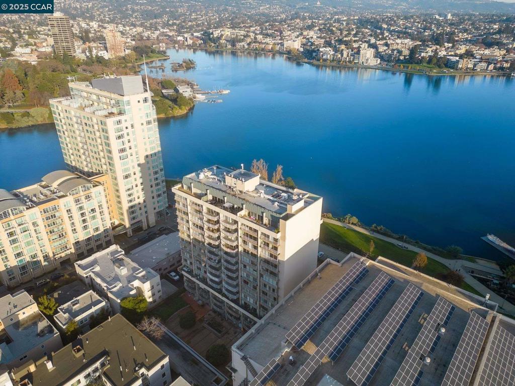 Experience one of Oakland’s premier addresses at the Lakeside Regency, built of steel & concrete in 1968 & designed by Michael Marx, AIA—an apprentice of Frank Lloyd Wright. This mid-century modern gem spans 1,384 square feet on a single-level 18th-floor plan, offering an ideal separation of private & public areas. A floor-to-ceiling wall of windows in the living area - an entertainer’s dream with panoramic Oakland skyline views. This residence features a beautifully appointed kitchen equipped with an electric cooktop, dishwasher, oven, microwave and refrigerator, making meal preparation a breeze. There are two spacious bedrooms and two remodeled bathrooms, one with a tub and one with dual sinks. The home boasts stunning hardwood flooring throughout, adding a touch of elegance and ease of maintenance. For your convenience, there is a dedicated laundry area. Building amenities offer the best in urban living: 24-hour door service, a shared mezzanine, a roof deck, & a clubhouse. Your unit comes with one deeded parking space & an additional storage closet. Pets welcome. And with Lake Chalet Restaurant, Oakland Museum, Lake Merritt BART, & more just steps away, you’ll have everything you need right at your doorstep! Views: Downtown