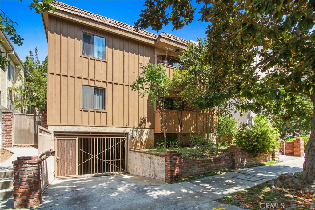 This bright and stylish 2-bedroom, 2-bathroom one-level condo is ideally located inside gated community on a quiet, tree-lined street in prime Westwood. The front-facing unit enjoys abundant southern exposure, filling the open-concept living and dining area with natural light and featuring laminate wood flooring, a cozy fireplace, and access to both a private balcony and a spacious outdoor patio. Both bathrooms are modern and tastefully updated. Additional features include central heating and air conditioning, two-car tandem parking in a secure underground garage and extra storage etc. Just minutes from UCLA, shopping, dining, theaters, and more, this home offers the perfect blend of location, convenience, and contemporary living.