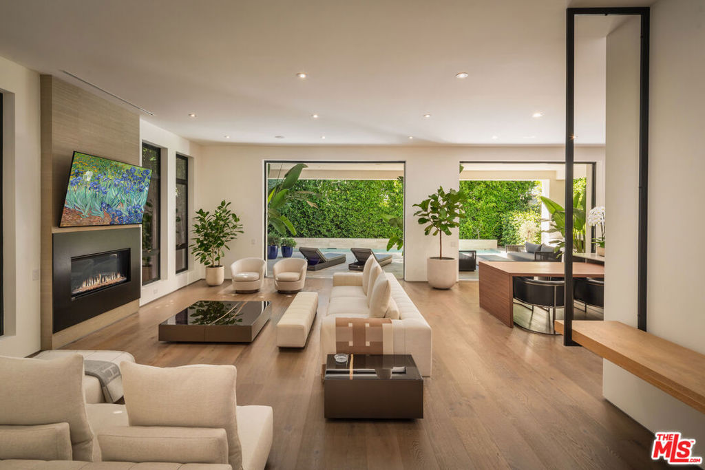This beautiful Spanish-style modern home offers 5 bedrooms and 5 bathrooms in a prime location near the Beverly Center and The Grove. With an open floor plan, floor-to-ceiling windows, and a private patio off the primary suite with his-and-hers walk-in closets, the home blends style and comfort seamlessly. Built by Signature Prime Five Homes, it features eco-friendly construction, energy-efficient design, and state-of-the-art smart home technology with touchscreen controls throughout.