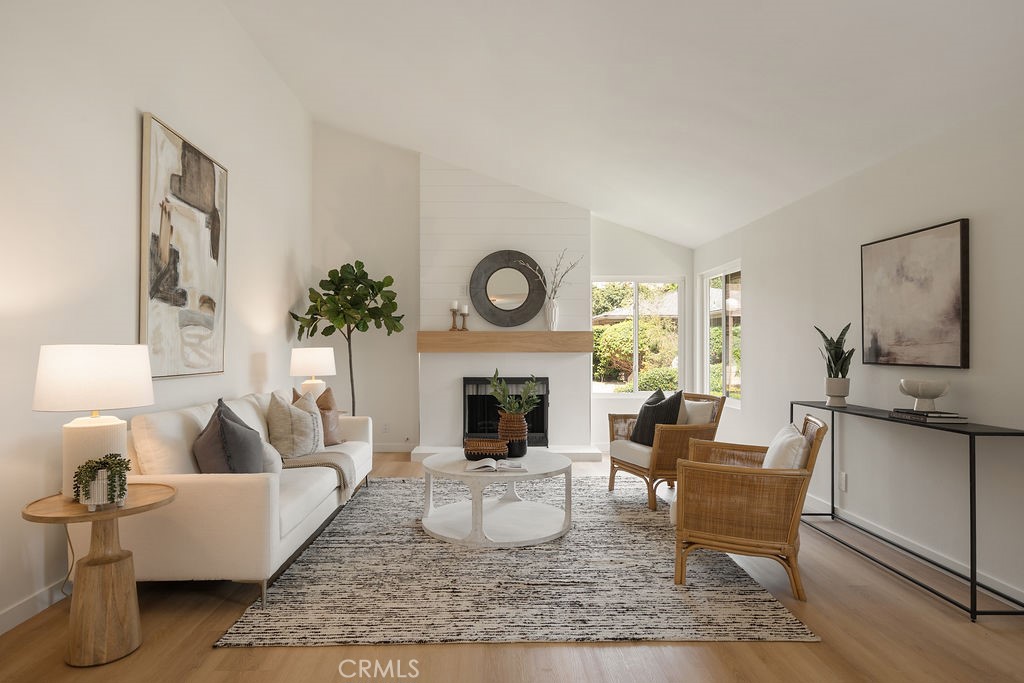 This beautifully updated Shady Hollow home is the perfect blend of style, comfort, and community. Step inside to soaring vaulted ceilings and an abundance of natural light that accentuate the open floor plan. The home’s interior has been refreshed with new luxury vinyl plank flooring, while the reimagined fireplace with its sleek modern surround and wood mantle creates a warm, stylish focal point.
The kitchen shines with quartz countertops, crisp white cabinetry, and a convenient pass-through bar, making it as functional as it is inviting—ideal for both everyday meals and effortless entertaining. Both bathrooms have been thoughtfully updated with modern vanities, creating fresh, clean spaces that feel like a personal retreat.
Off the primary suite, discover a charming atrium space that offers endless possibilities—whether you dream of a cozy morning café nook, a sunny plant-filled garden room, or a quiet retreat for reading and relaxation. Sliding glass doors throughout the home connect to the outdoor patio, enhancing the easy indoor-outdoor flow that California living is all about.
Practical features include a 2-car attached garage and a highly desirable location within the Tustin Unified School District, including Foothill High School. Beyond your front door, Shady Hollow residents enjoy resort-style amenities including a sparkling pool, soothing spa, and beautifully landscaped green spaces, perfect for unwinding close to home.
All of this comes together in a peaceful, well-connected community just minutes from local shopping, dining, parks, and convenient freeway access. This Shady Hollow home truly offers the best of both comfort and lifestyle.