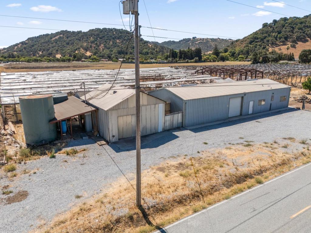 This is an incredible opportunity to own 10 AC in North Morgan Hill. This unique property was formerly a vegetable and flower farm and offers tremendous versatility. It includes a 1,200± SF. permitted break room with 3 rooms and 2 full baths, a 600± SF. vegetable/flower preparation room, a 720± SF. metal shed, a metal barn, a muck room with full bath, and other miscellaneous buildings. In addition, the property features 2 new massive sheds for storage as well. Water resources are abundant with a 300-ft deep well and two 2,000-gallon water tanks - one for well water storage and the other for Valley Water supply along with a brand new upgraded well system. The property is connected to natural gas and electricity, making it ready for a wide variety of uses. Not to mention, this property is having permits pulled to upgrade to 1200 amps of power. Endless possibilities await, whether you envision continuing agricultural operations such as vegetable or flower farming, establishing vineyards, or creating another agriculture-related business. Alternatively, you could build a custom home while converting the existing buildings into a second home. Located just minutes from Silicon Valley with easy access to Hwy 101, Santa Teresa Blvd, and Old Monterey Hwy, this property is truly a must-see!