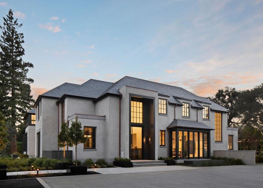 Conceived and constructed with the highest level of architectural innovation and the finest materials, this estate presents a rare blend of authentic timelessness coupled with modern aesthetic. The home was completed in 2019 and offers over 14,000 total square feet on an extremely private acre of land. The immaculate gourmet kitchen will please the most discerning chef, while the adjacent great room offers a compelling venue for relaxed gatherings. Accessible by an elevator and dual staircases, the upper level of the residence features a luxurious master retreat and three additional bedroom suites, while the lower level is poised for recreation with a home theater, exercise studio, entertaining bar and wine room. Interior comfort fluidly transitions to outdoor amenities including a full guest house, fire pit, entertaining pavilion, sport court, pool, spa and elegant dining terrace with overhead market lights. This exceptional residence is just moments from top private schools.