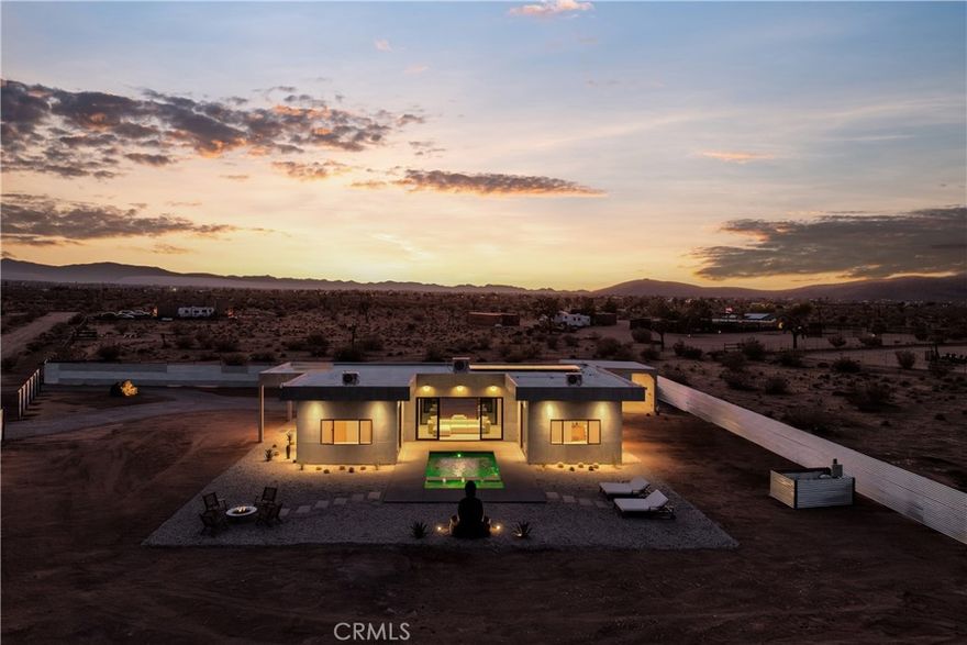Stunning new construction in Joshua Tree!

Experience the best of desert living in this beautifully crafted new home, featuring two spacious master bedrooms with en-suite bathrooms and an additional half bath for guests. The heart of the home is a bright, open-concept layout that connects the kitchen, living room, and outdoor area, creating a perfect flow for entertaining. Step outside to a private backyard oasis complete with a custom pool and jacuzzi, ideal for relaxing or hosting friends. Additional features include a 2-car carport, high-end finishes, and expansive spaces designed for comfort, style, and functionality. Whether you're looking for a forever home or a high-performing short-term rental, this is a must-see!