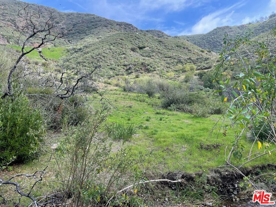 5 Acres nestled in a lush greenbelt valley at the rural west end of Malibu. Country living at Its Purest.  Rare opportunity to own approximately 5 acres in one of Malibu's most serene and private settings.  This expansive parcel offers a truly idyllic lifestyle just minutes from Leo Carrillo Beach and the untouched beauty of Malibu's pristine coastline. The property features ample useable land, studded with majestic oak trees and seasonal streams, creating a rich natural habitat perfect for those seeking tranquility, space, and a connection to nature. Surrounded by open space and rolling hills, you'll enjoy endless hiking, exploring, and riding trails, with parklands and dedicated paths just moments away. Previous planning includes Approval in Concept for a 6,280 sq ft home (expired), Approved Preliminary Fuel Modification Plan (expired), Perc Test and Preliminary Geology completed in 2007. This land is ideal for those dreaming of building a custom estate in one of Malibu's last remaining rural enclaves. Easy to view and situated next to 33874 Mulholland, this is a great opportunity to treat your land buyers to something truly special. Note: As with all vacant land, agents and buyers view at their own risk.
